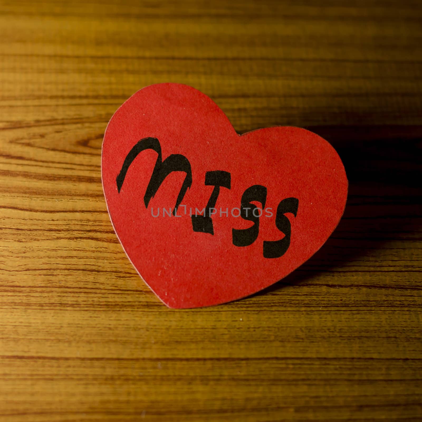 red heart word miss on wood vintage stlye background