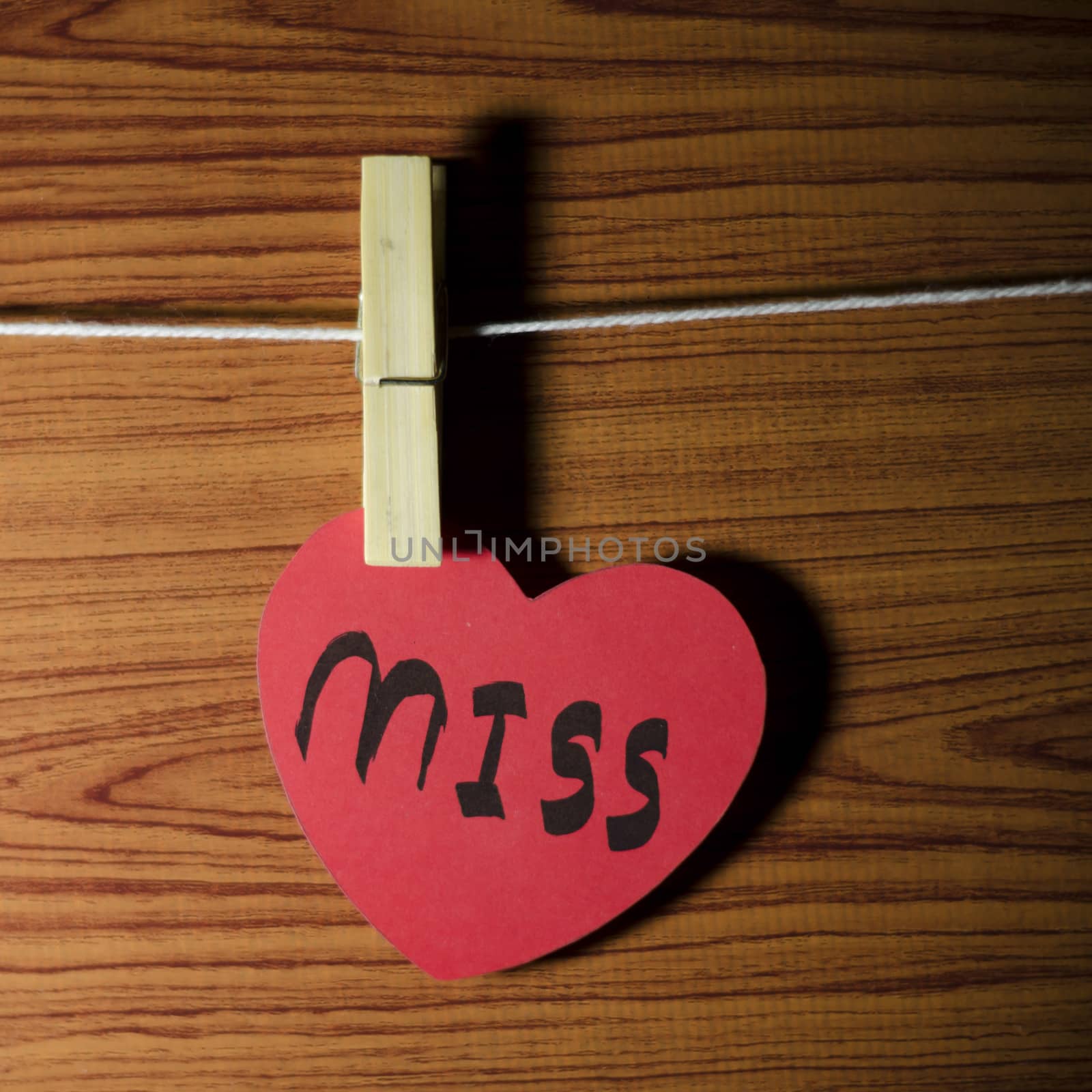 red heart word miss on wood vintage stlye background