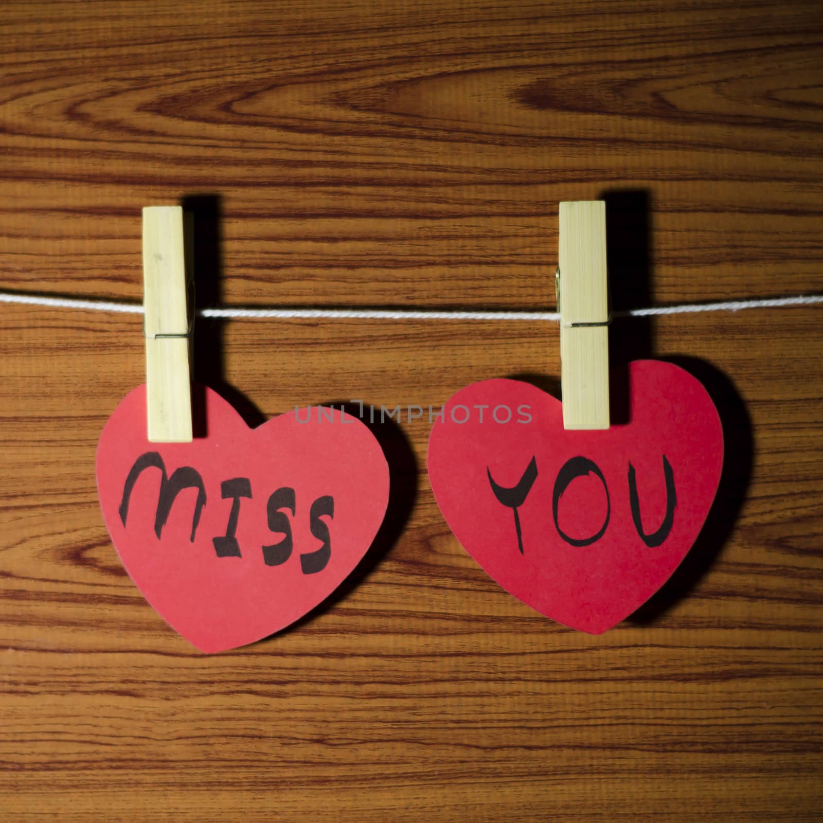 red heart word miss you on wood vintage stlye background