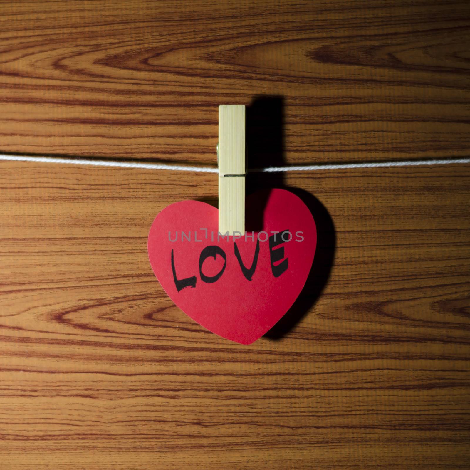 red heart word LOVE on wood vintage stlye background