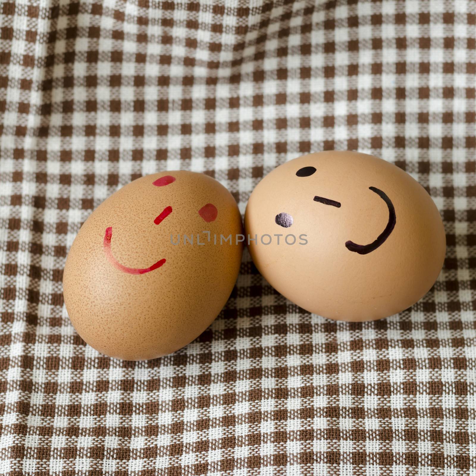 smile love egg couple in brown kitchen towel on wood table