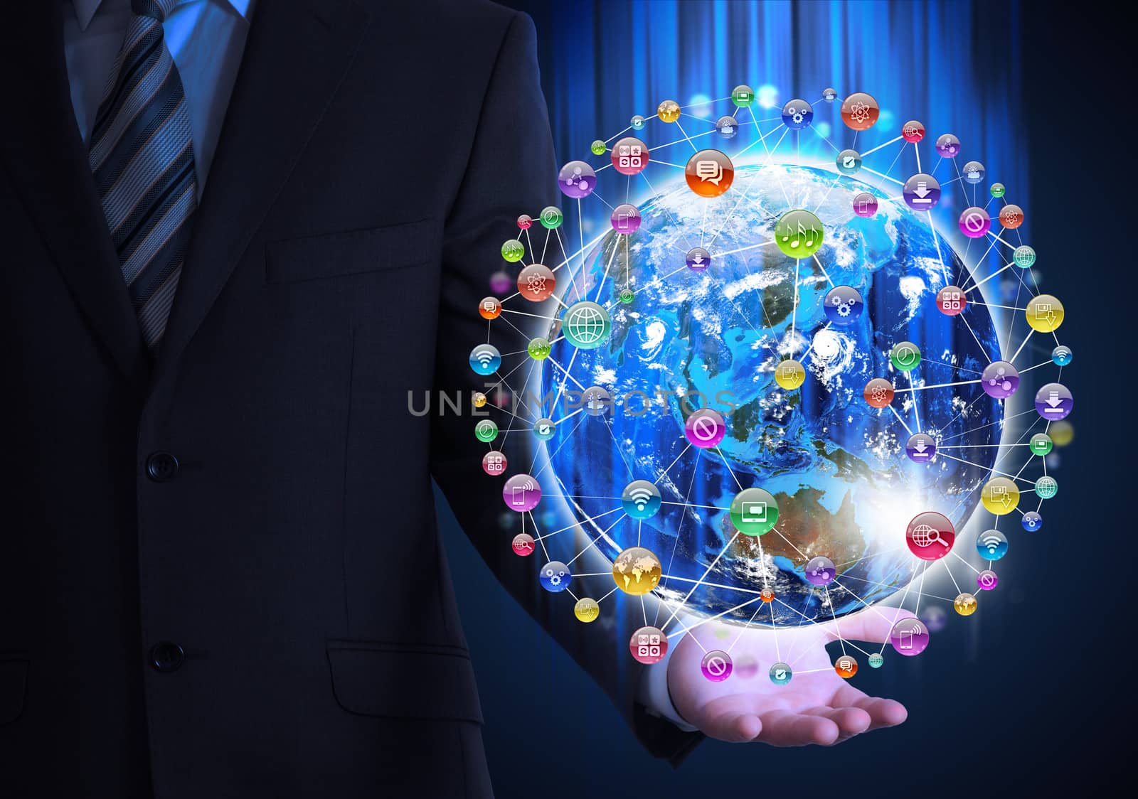 Man in suit holding a earth in hand. Application icons around earth. The concept of software