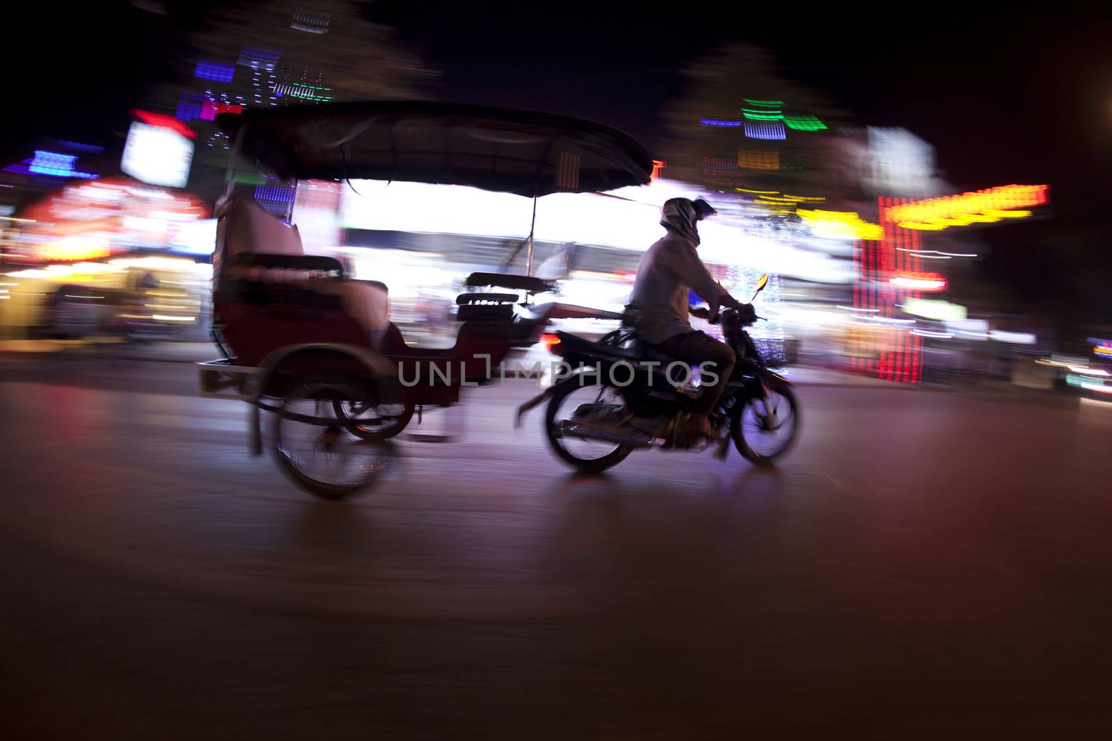 tuk tuk panning shot at night in Siem Reap Cambodia