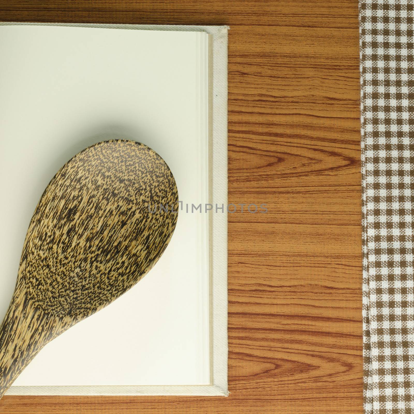 kitchen towel with spoon on wood background by ammza12