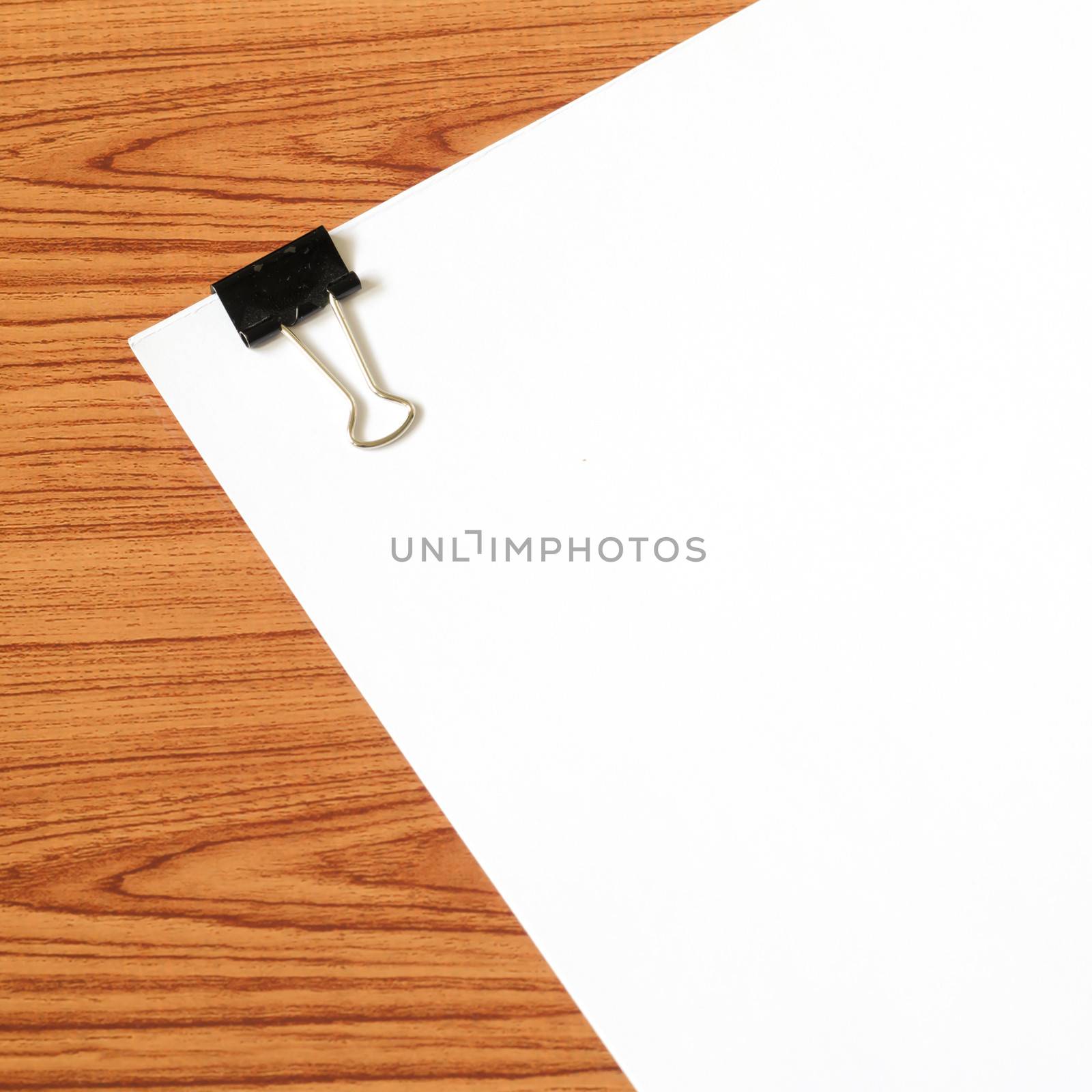 white paper on wood background