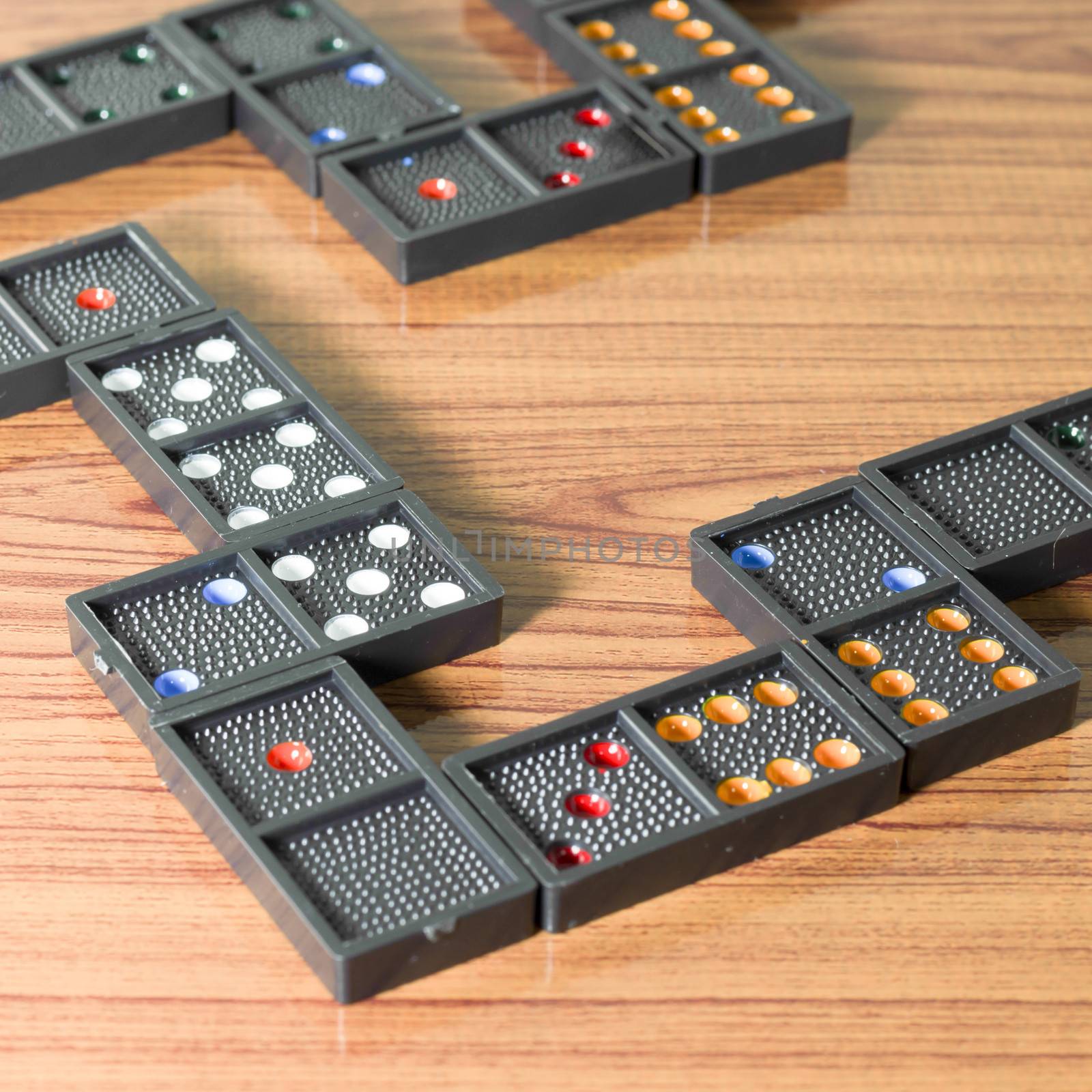 black domino on wooden background