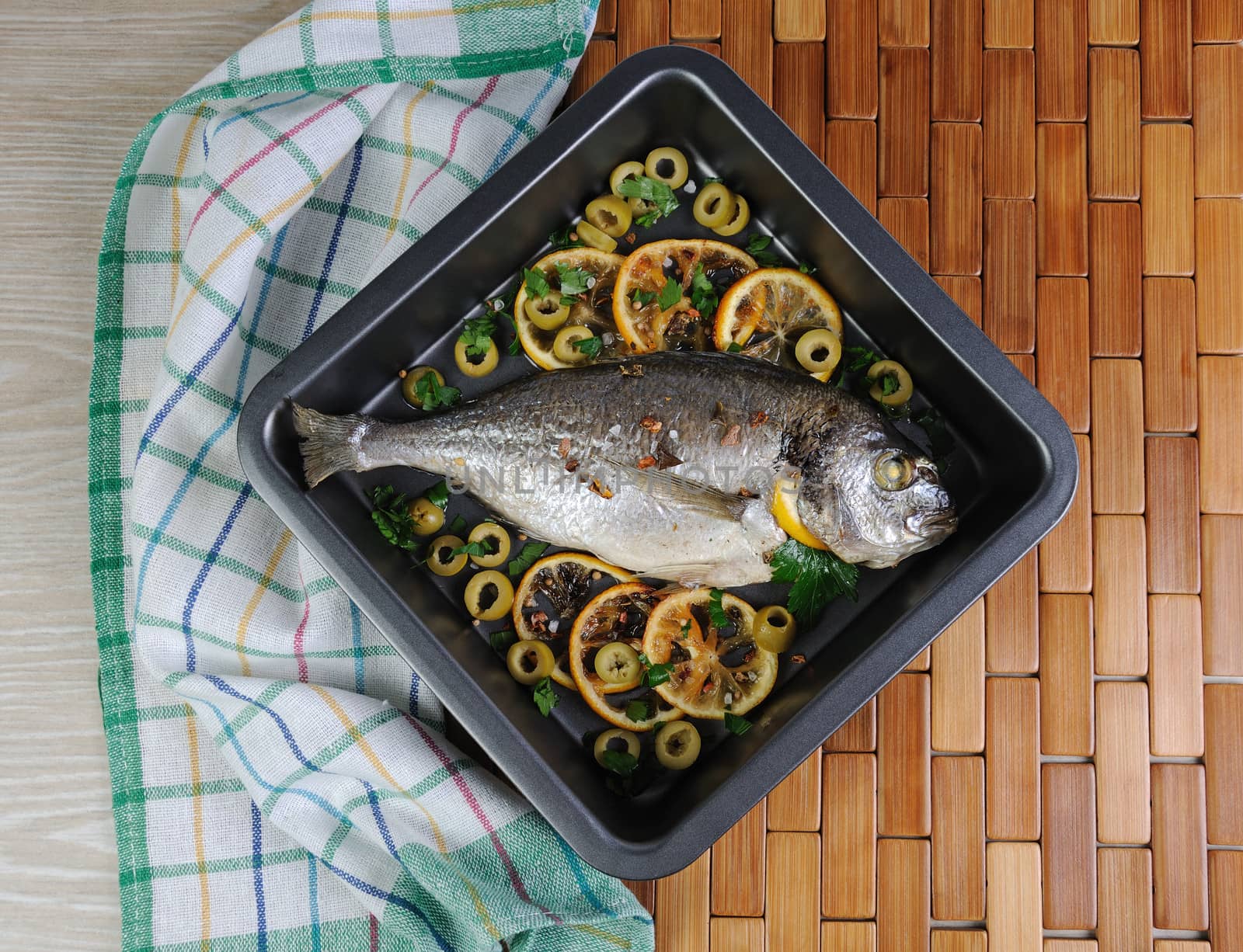 Baked Fish (Dorado) with lemon and olives



