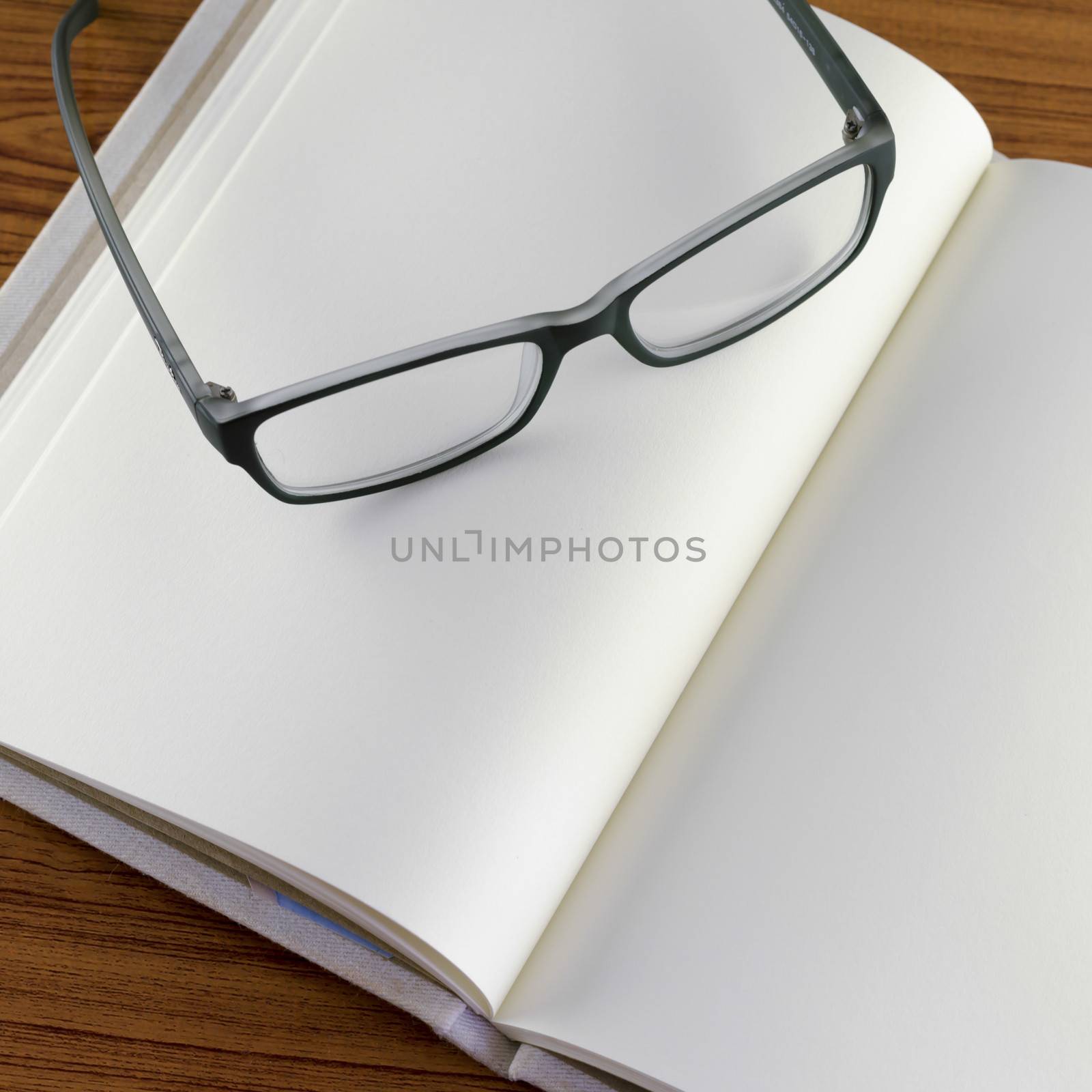 glasses on notebook by ammza12
