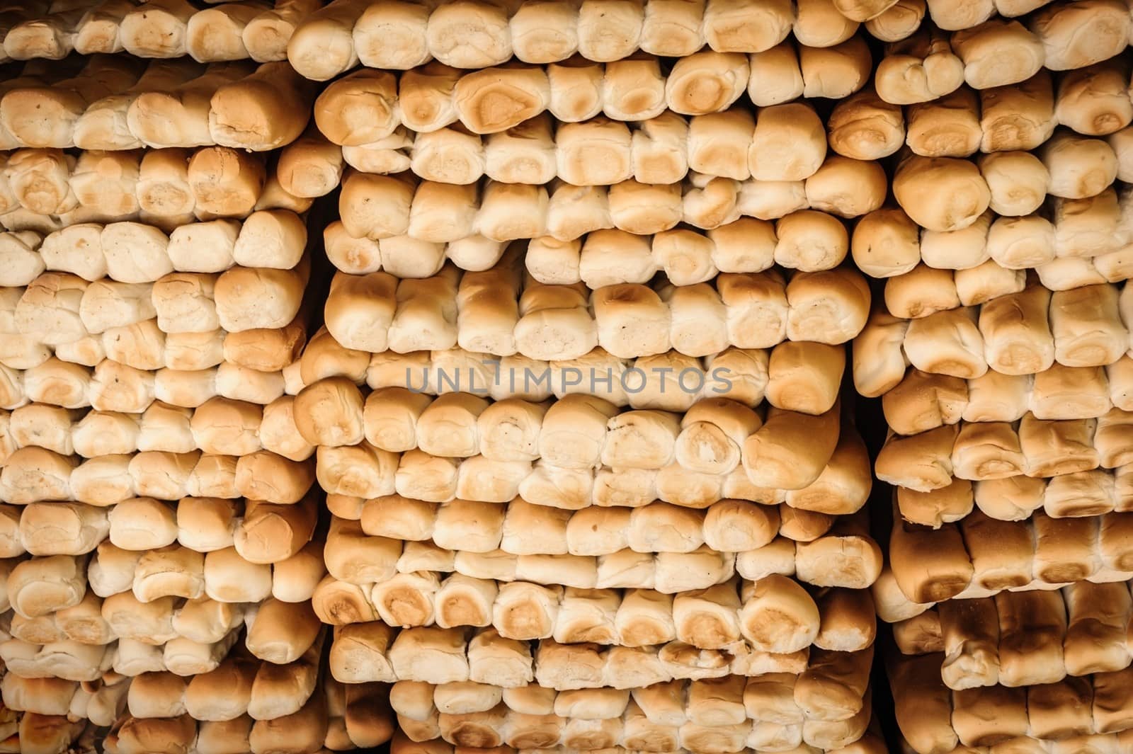 Rows of fresh bread in local market.