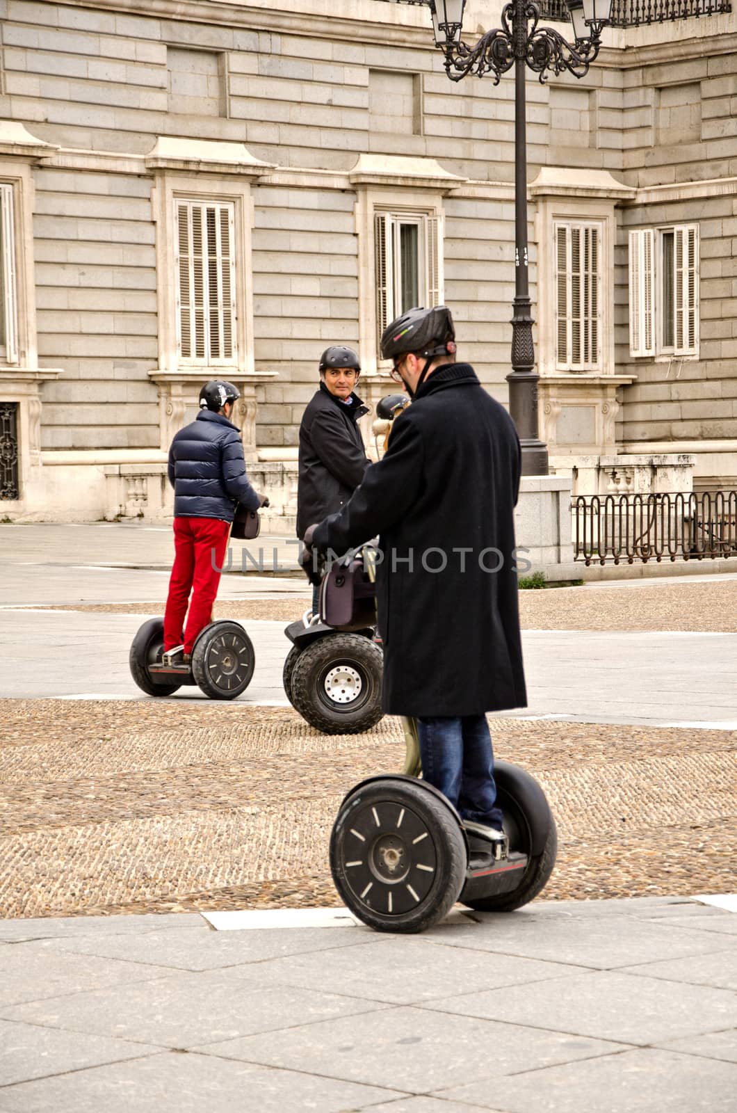 People in electric skateboard by lauria