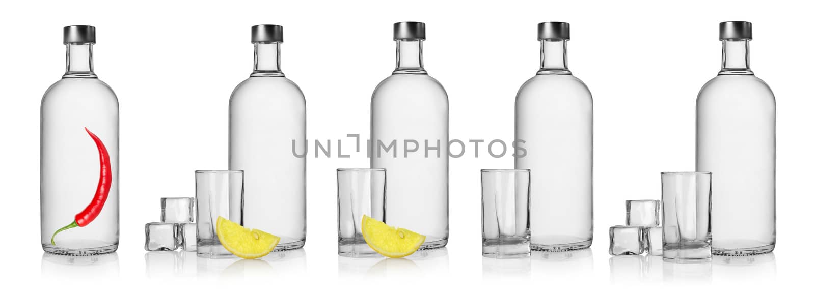 Bottles of vodka and glasses isolated on white