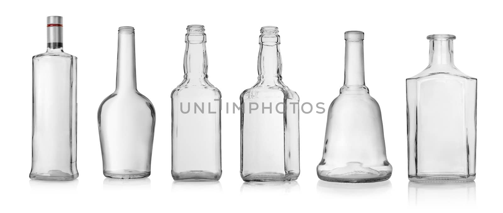 Collage of empty bottles of vodka and whiskey isolated on white