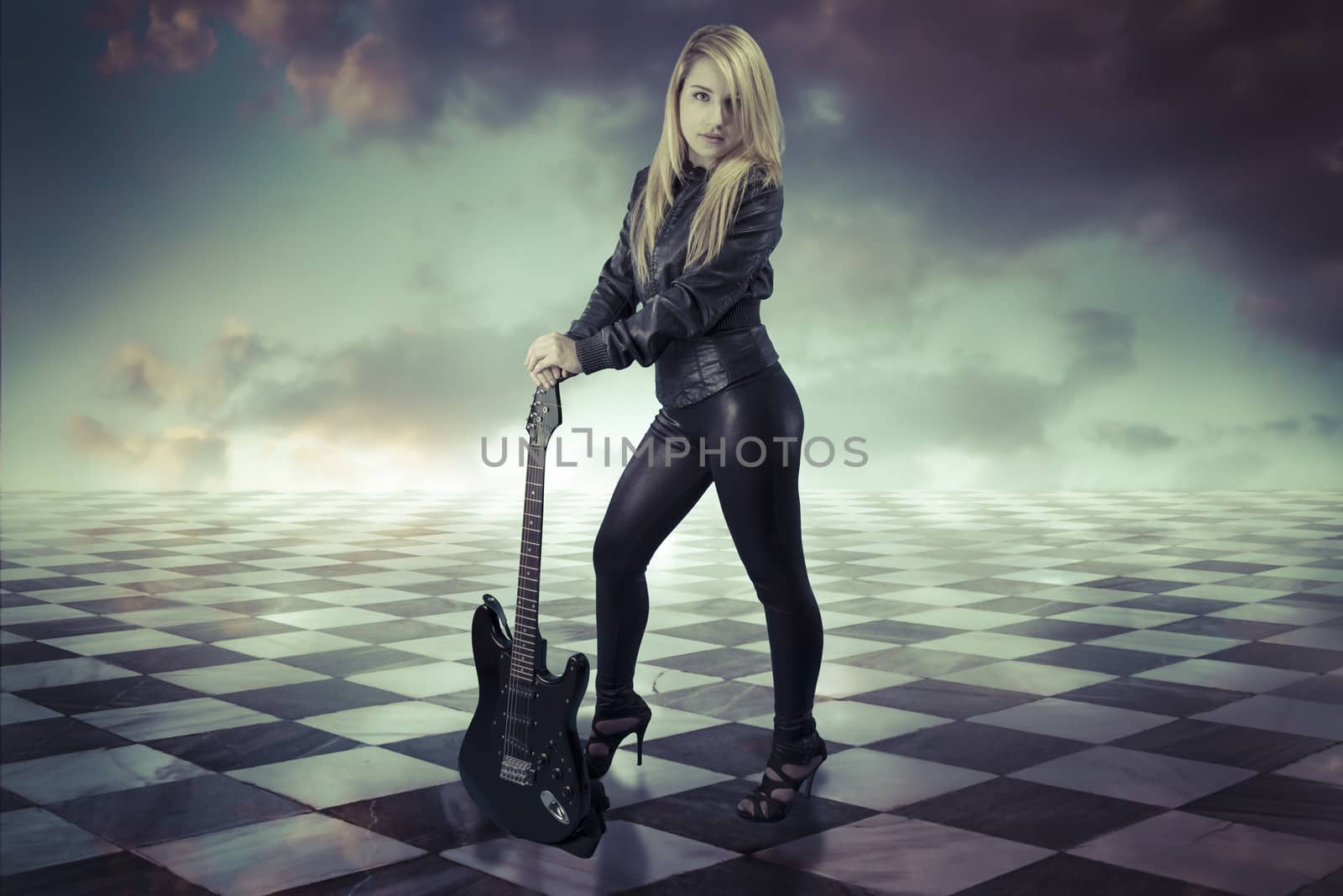 Young girl with black electric guitar.gamero chess, pieces marbl by FernandoCortes