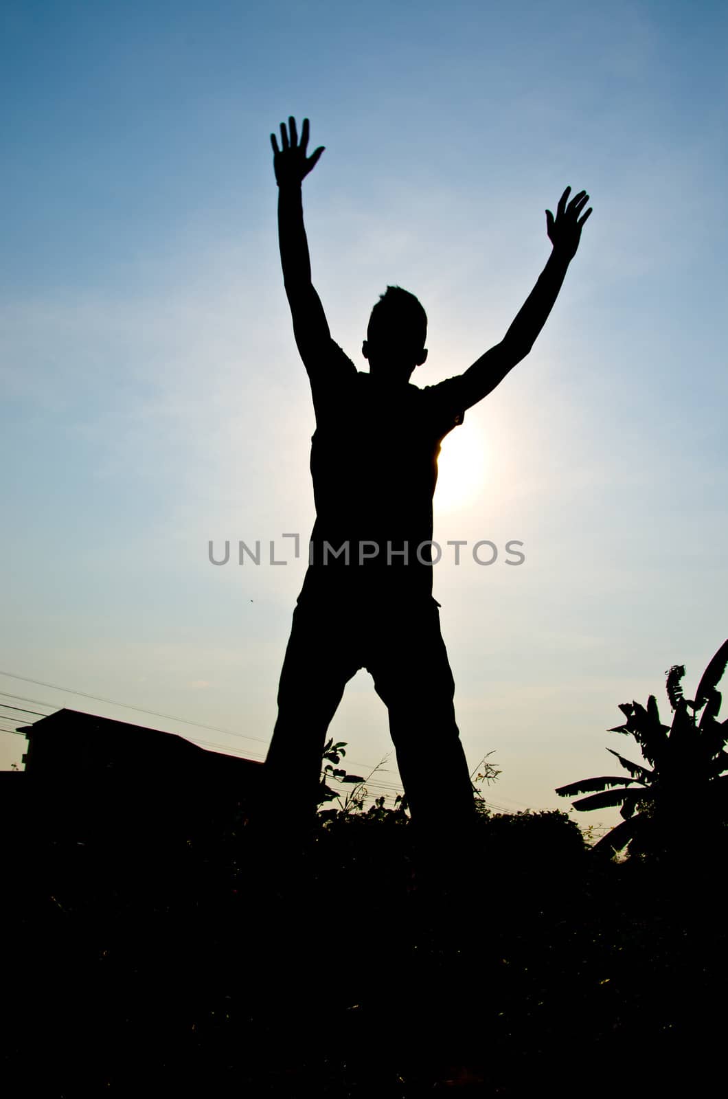 silhouette of man jumping for happy and hjappy