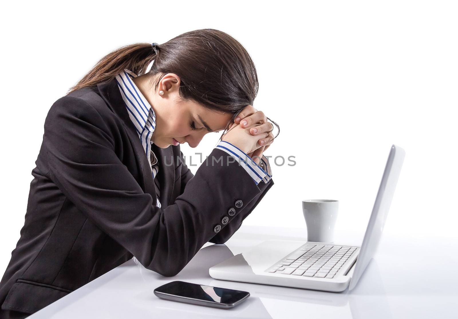 Portrait of stressed and tired young business woman with a laptop computer on white background