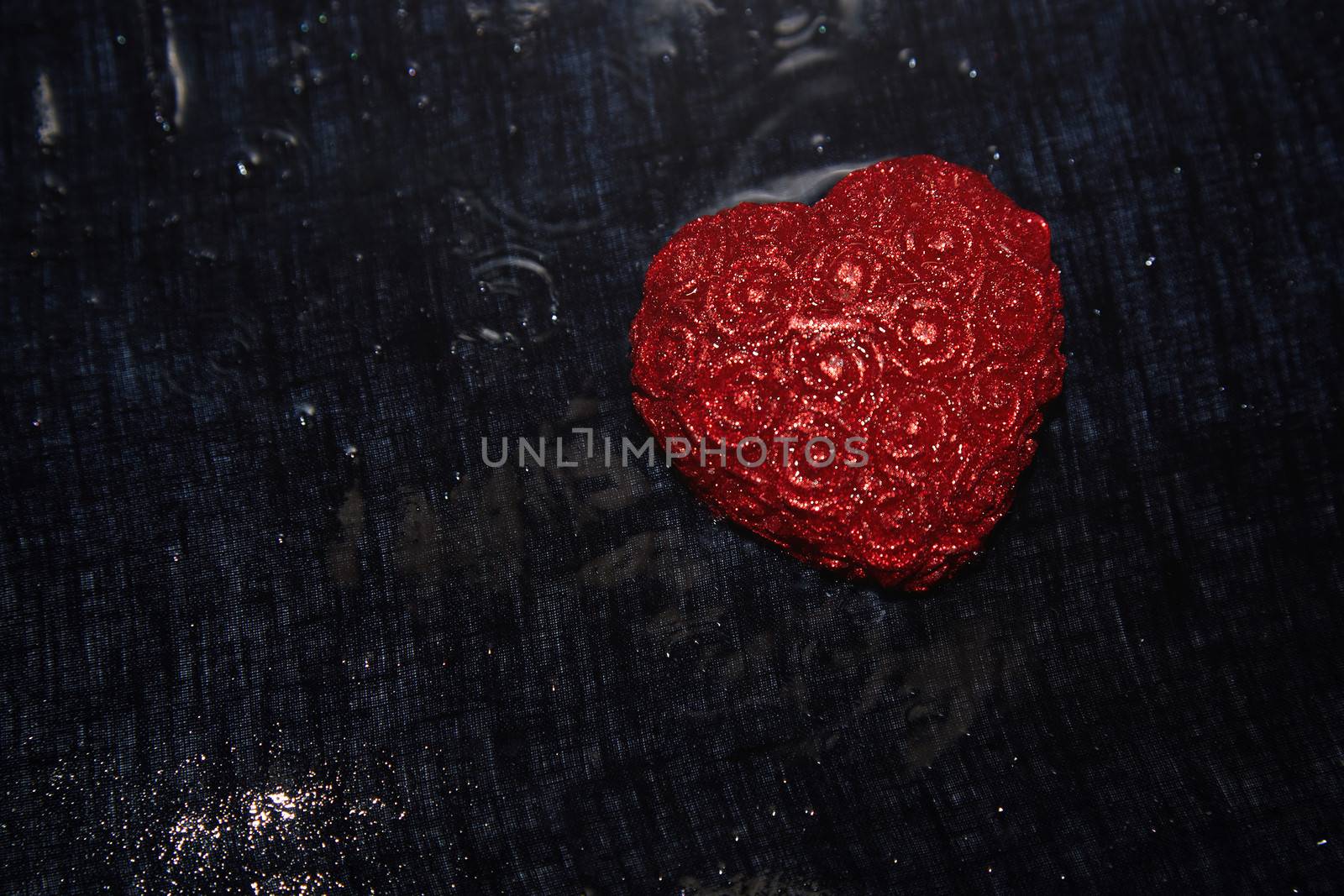 Heart shape in heavy rain. Close-up view