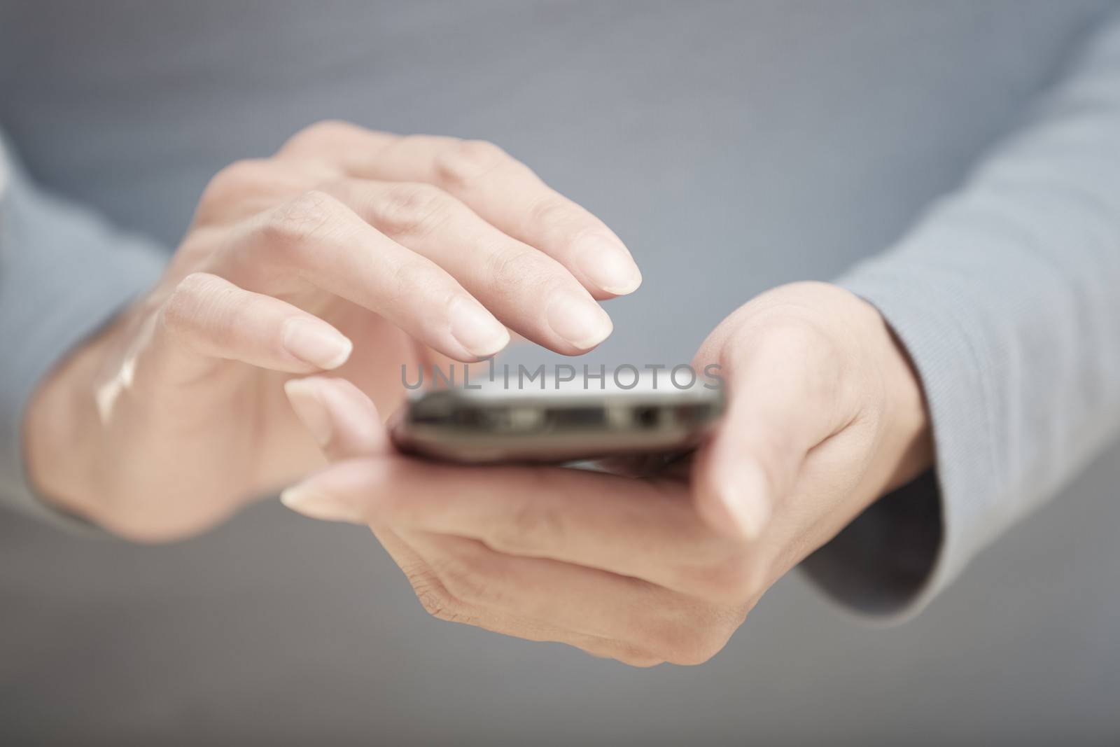 Human hands using smartphone with wi-fi Internet