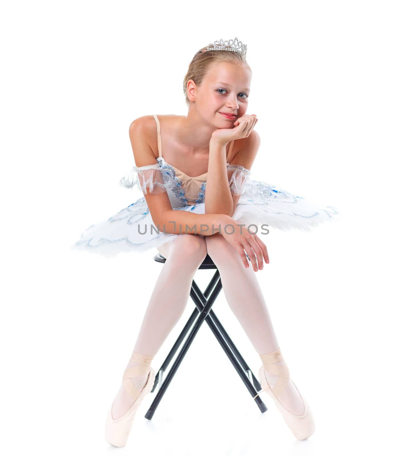 Beautiful young ballerina on a white background