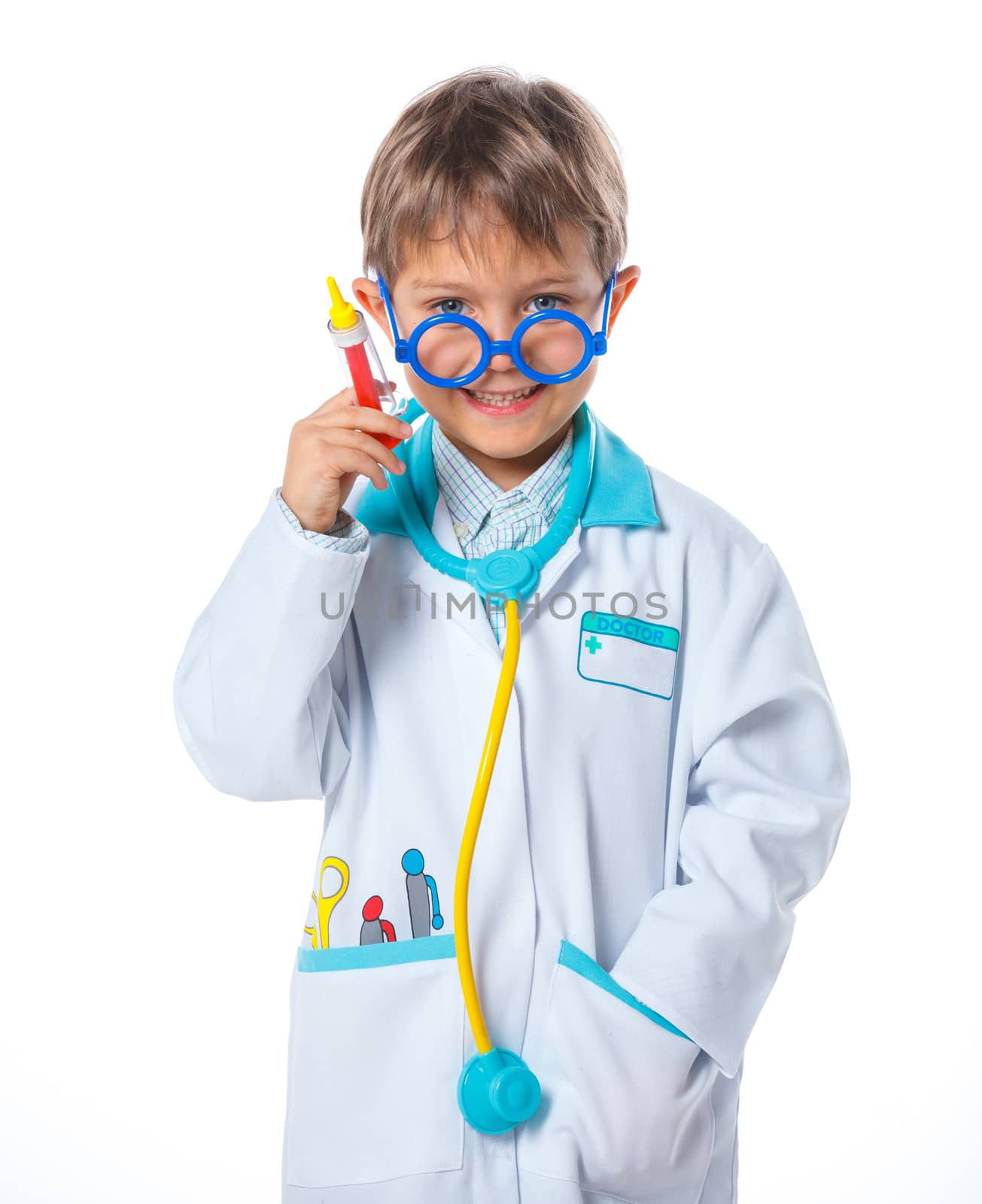 Portrait of a little smiling doctor with stethoscope and syringe. Isolated on white background