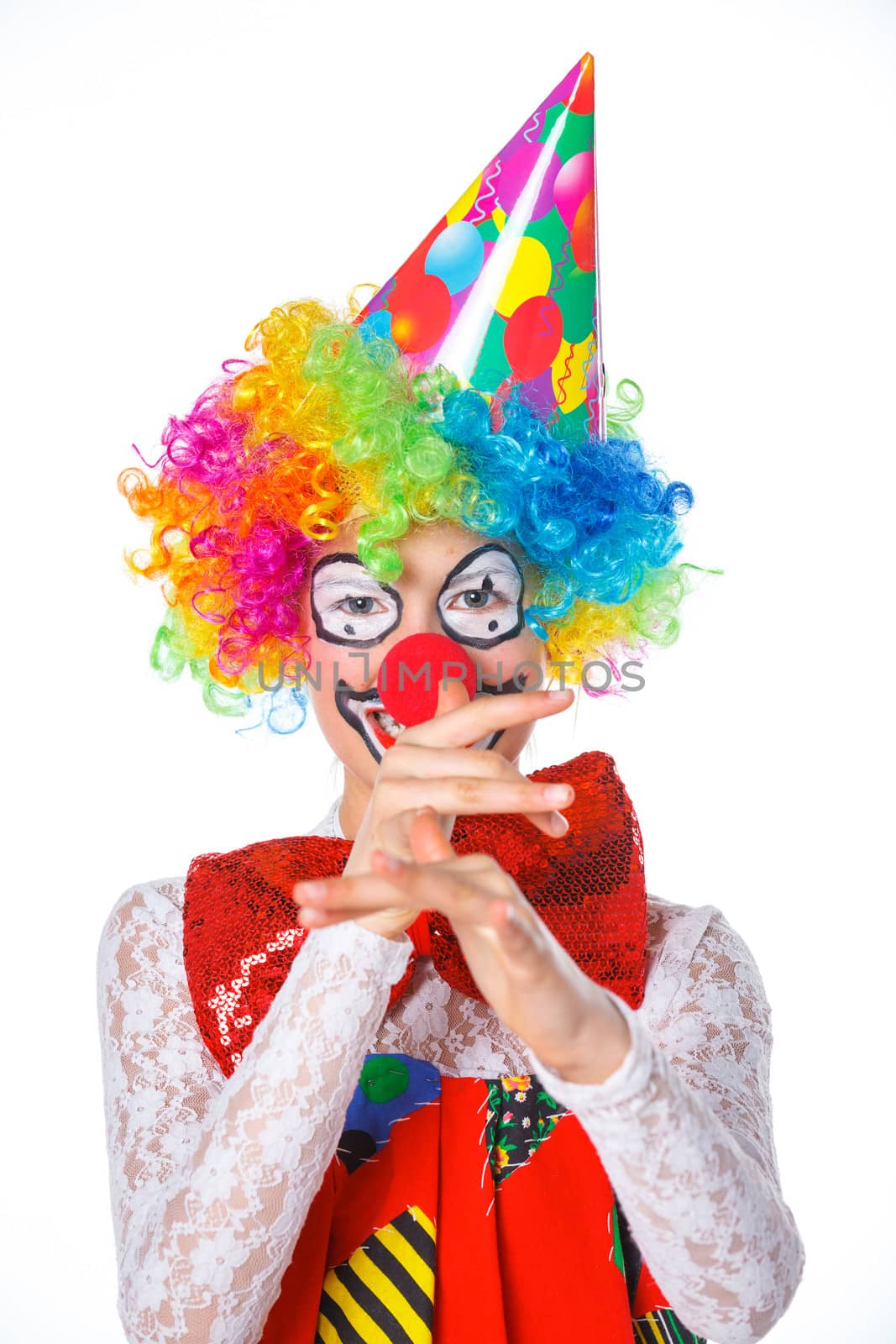 Portrait of a cute girl clown. Isolated on white background.