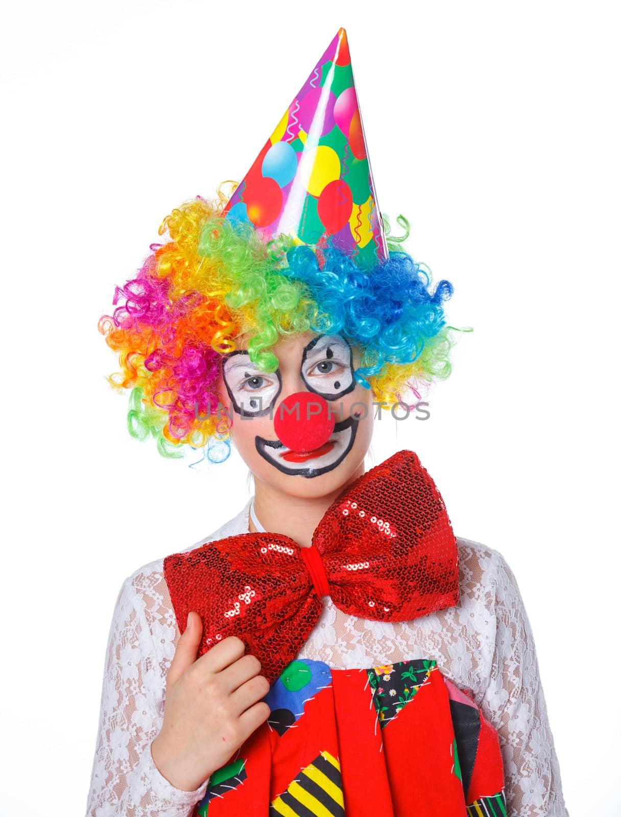 Portrait of a cute girl clown. Isolated on white background.