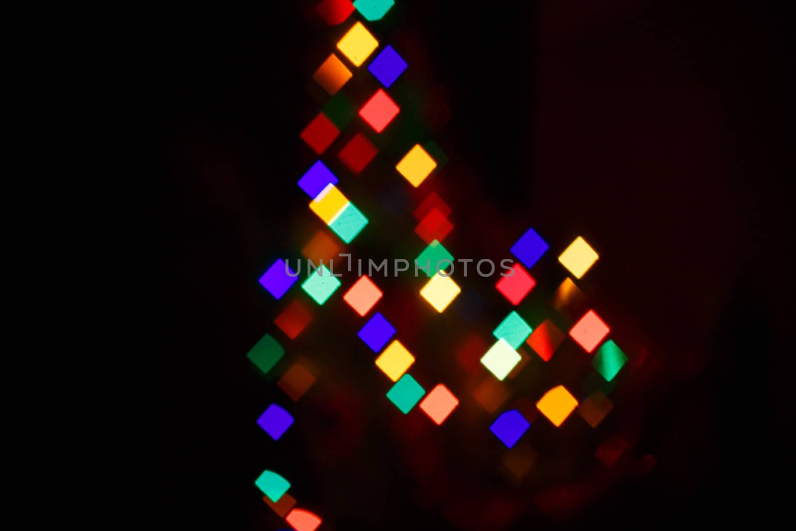 Abstract bokeh background in the form of squares on the night street