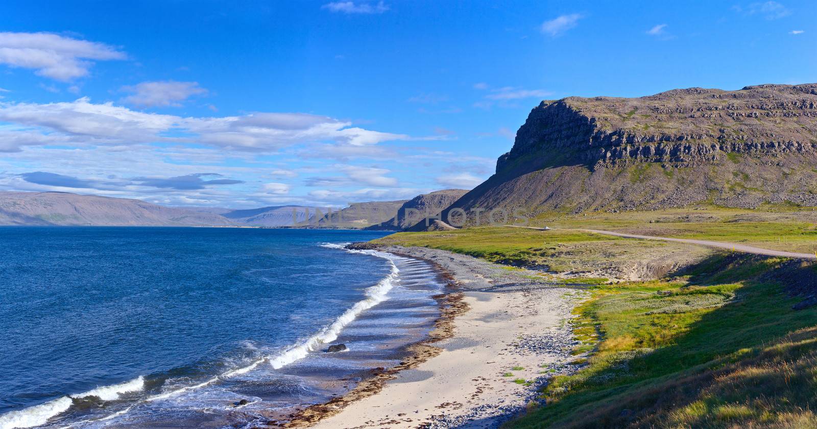 Landscape with low tide at Iceland ocean coast. Panorama.