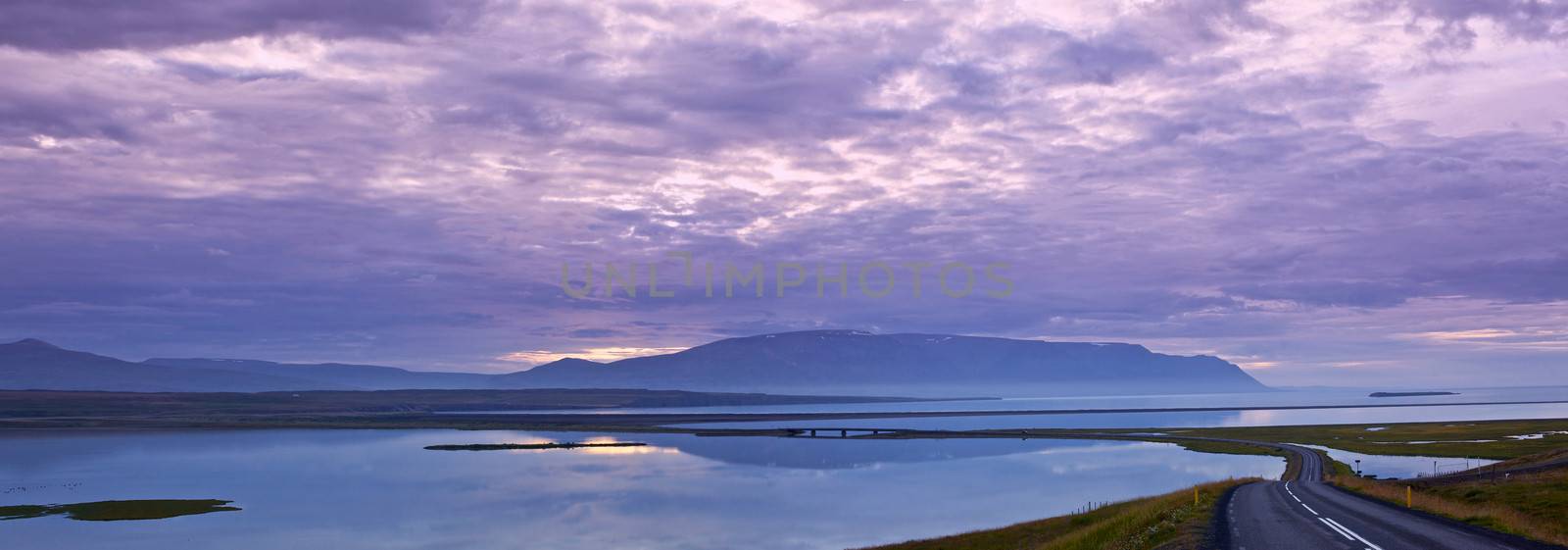 Icelandic landscape. Summer, fjord, sunset, road. Panorama. Iceland.