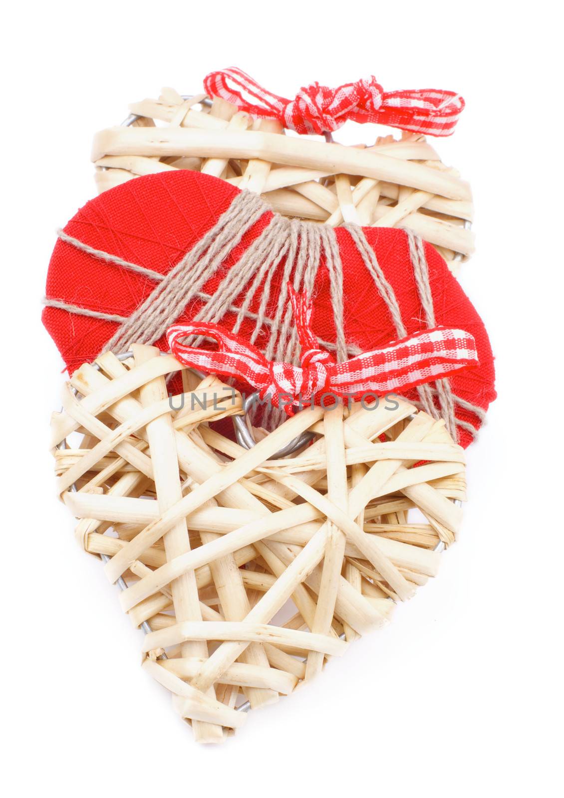 Three Handmade Wicker and Textile Valentine Hearts Overlapped In a Row isolated on white background