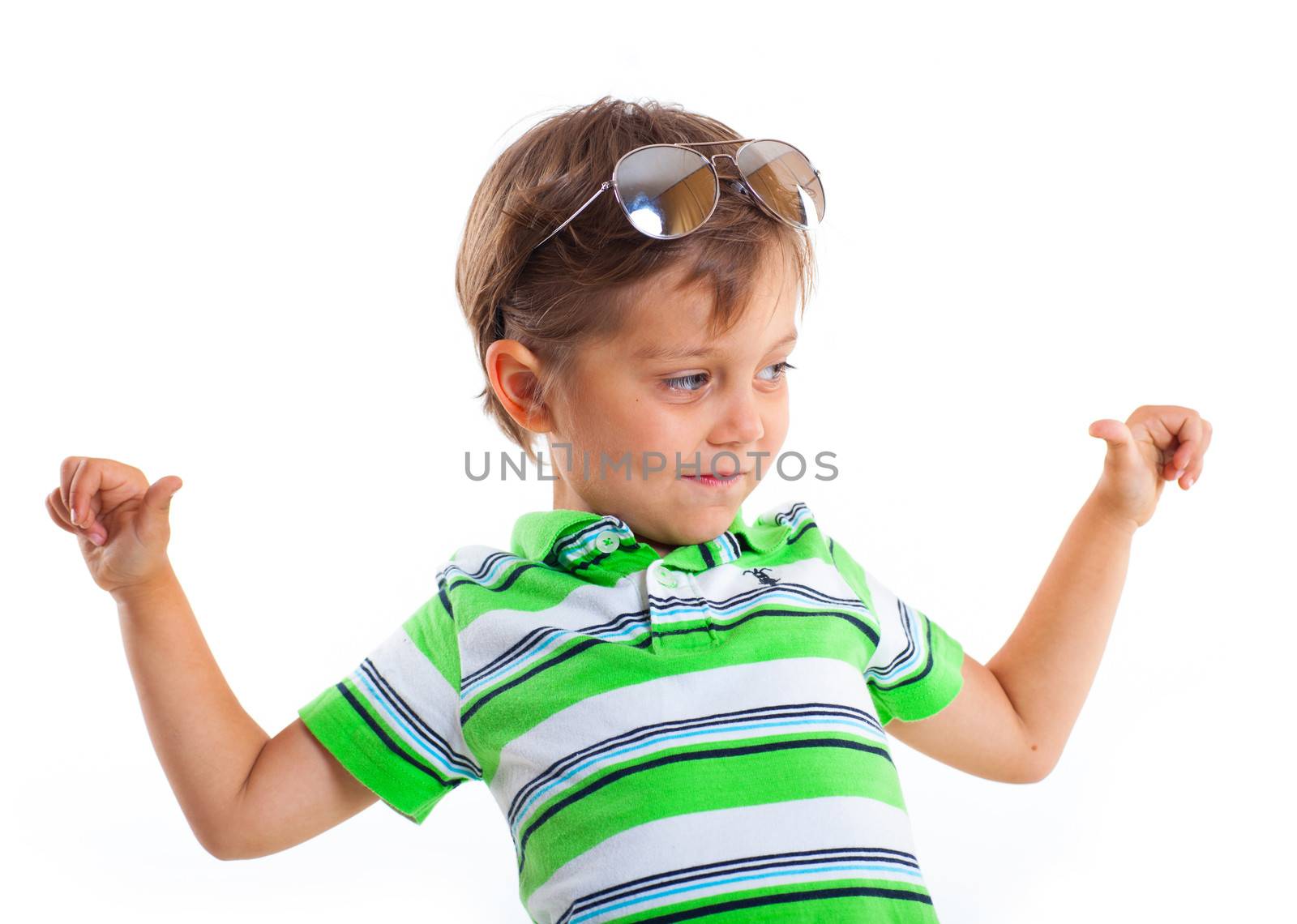 Close-up portrait of a boy with sunglasses and wearing green clothing. Isolated on white background