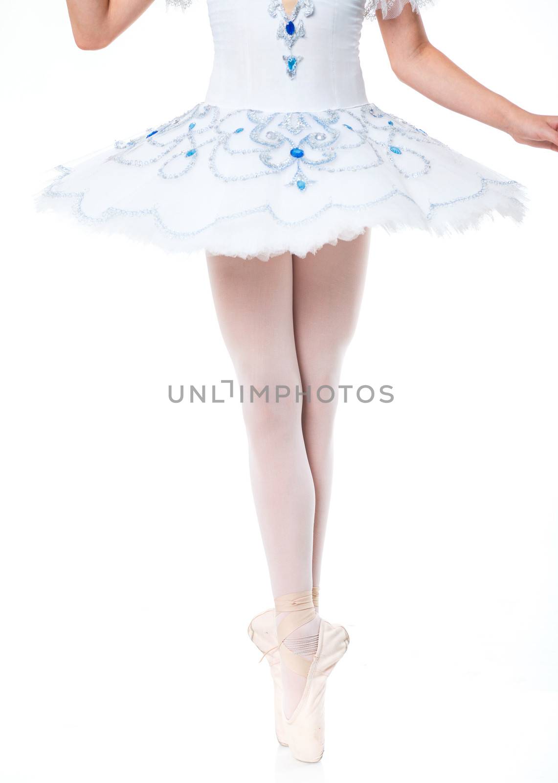 Closeup ballerina's feet over a white background