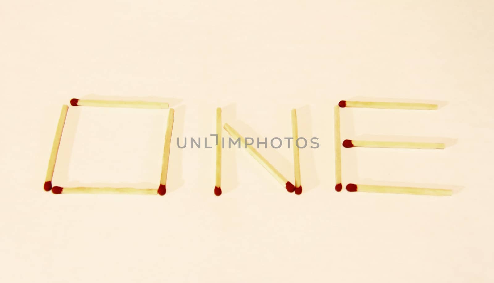 Word One signing by matches isolated on the white background