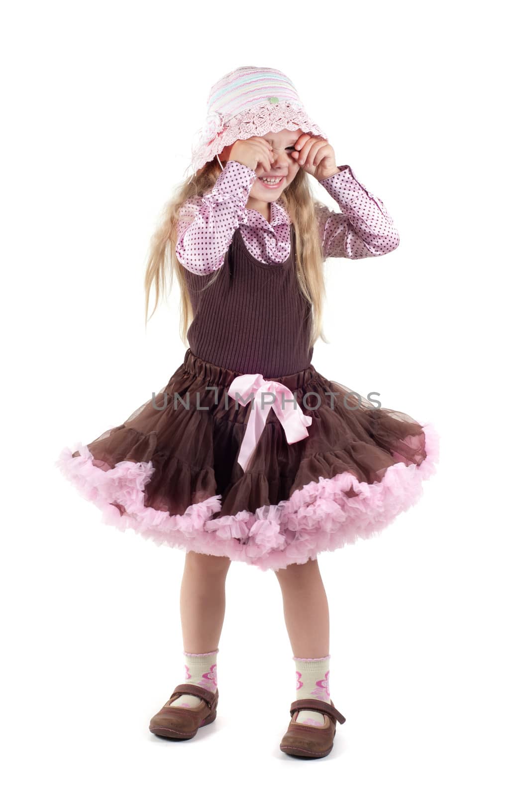 Shot of happy little girl with long blond hair in studio