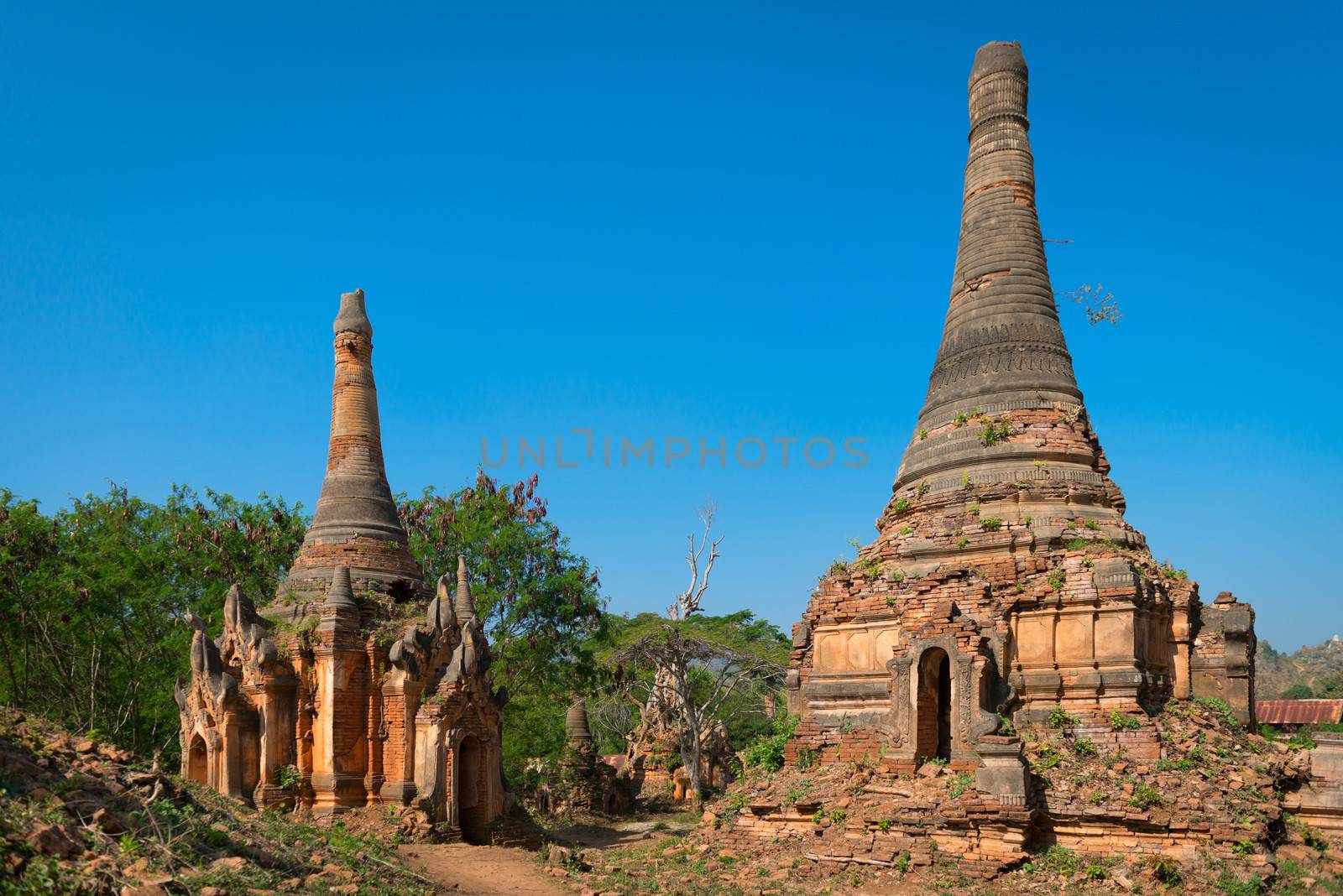 Ruins of ancient Burmese Buddhist pagodas Nyaung Ohak in the village of Indein on Inlay Lake in Shan State, Myanmar (Burma).