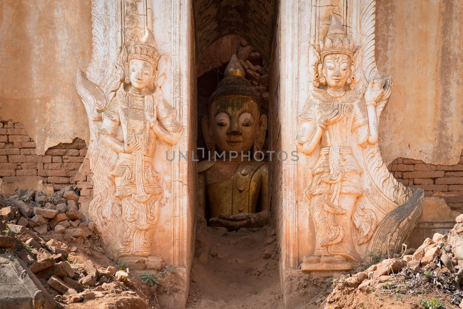 Buddha image inside of ancient Burmese Buddhist pagodas Nyaung Ohak in the village of Indein on Inlay Lake in Shan State, Myanmar (Burma).