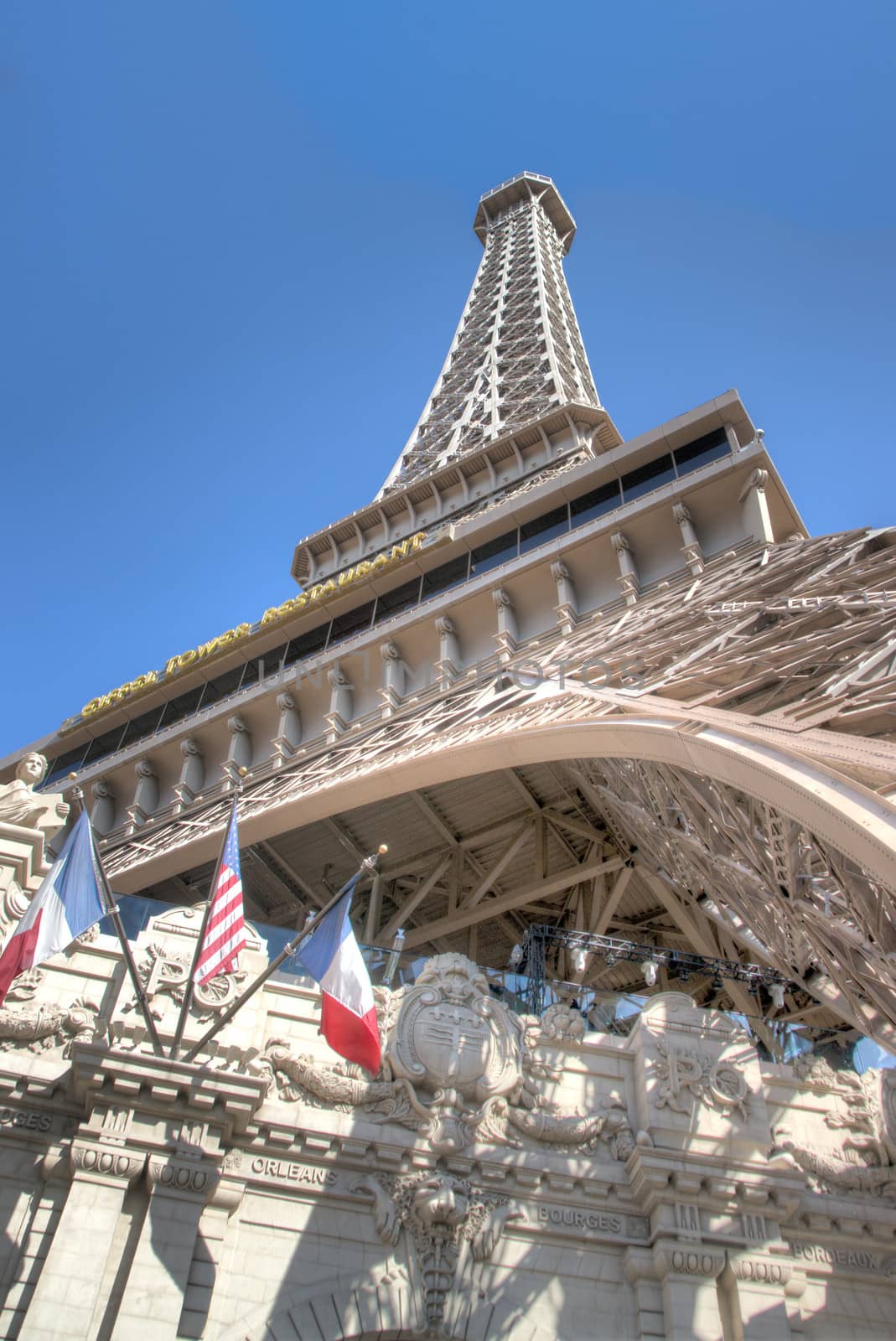 Eifel Tower with American and French Flags shot from low perspective