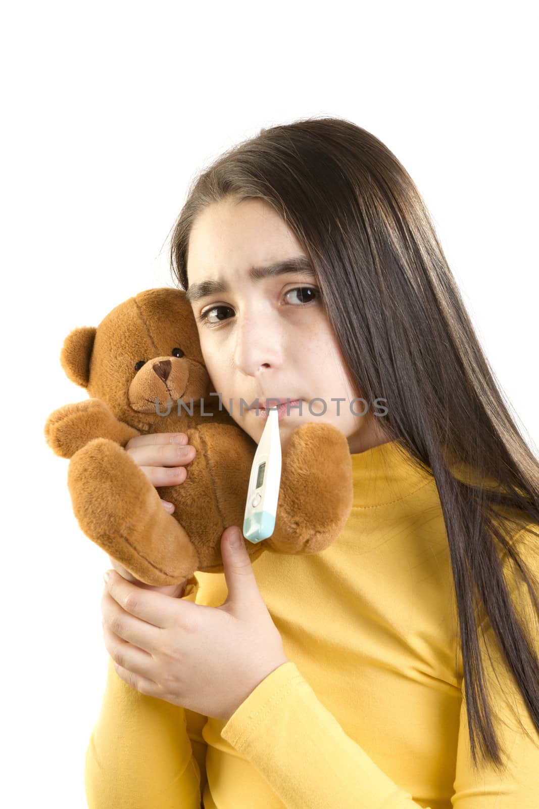 cute sick girl measures the temperature and holding teddybear