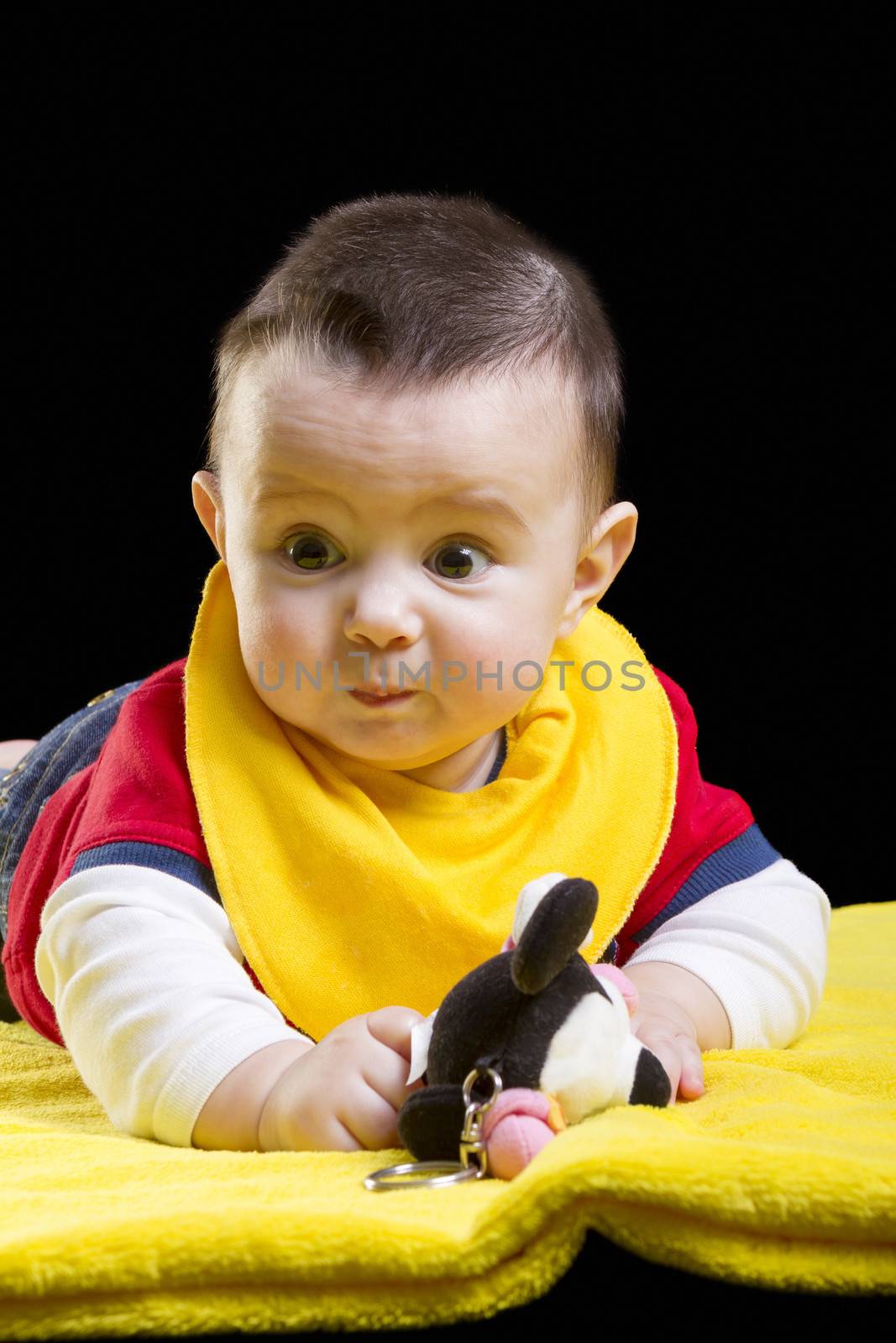 Baby boy on yellow blanket