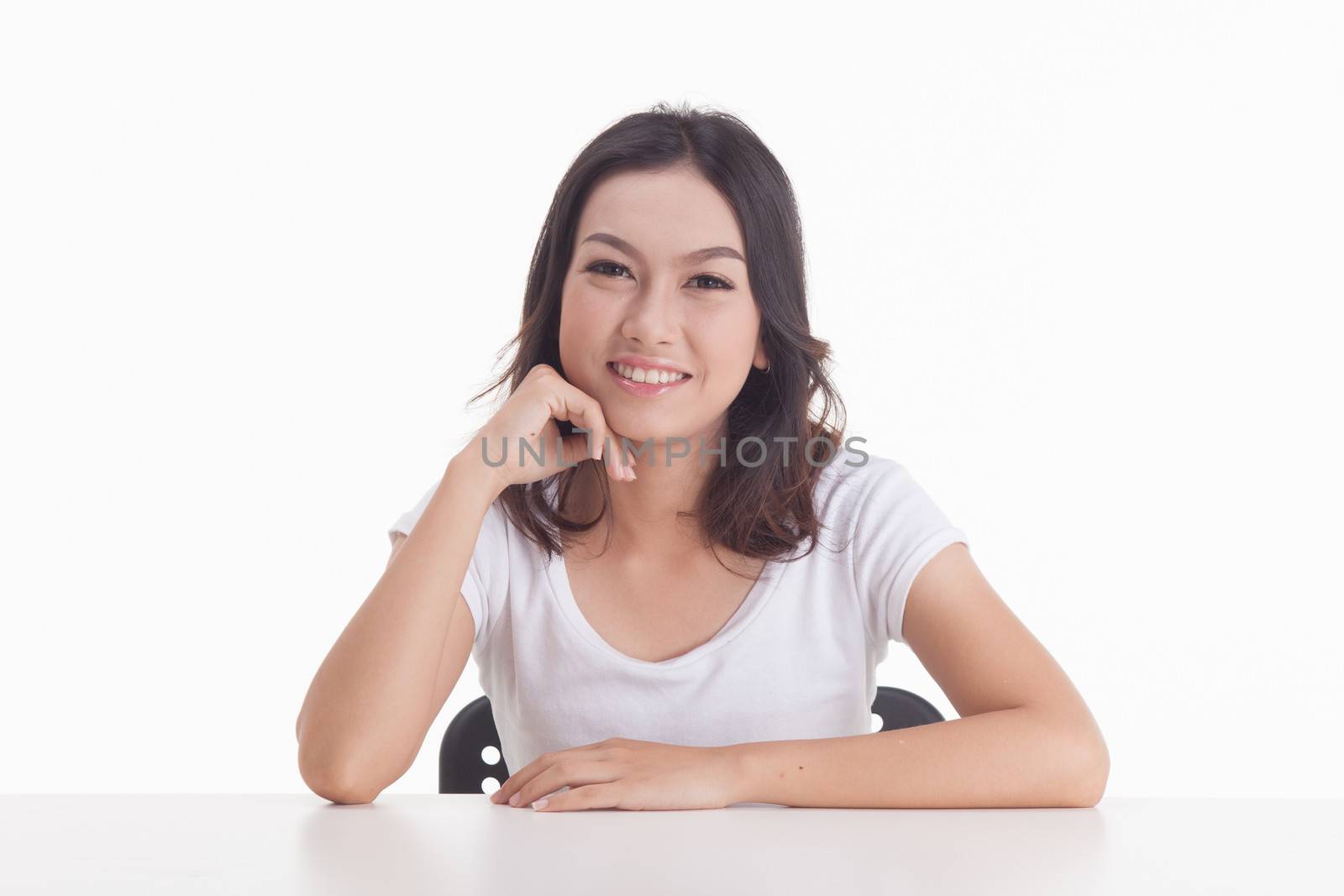 Asian woman isolated on white background. white t-shirt, sit on chair with table