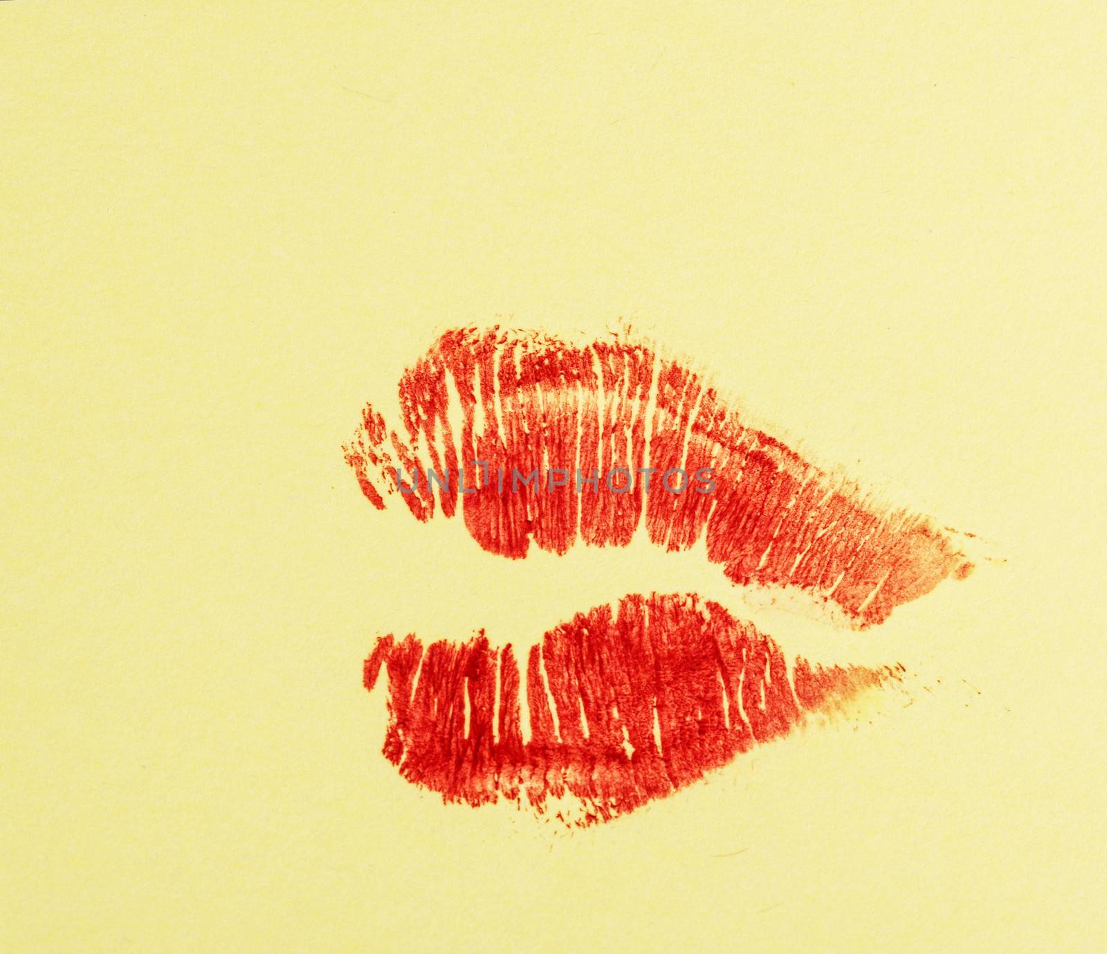 Imprint of lipstick passionate female lips closeup shot