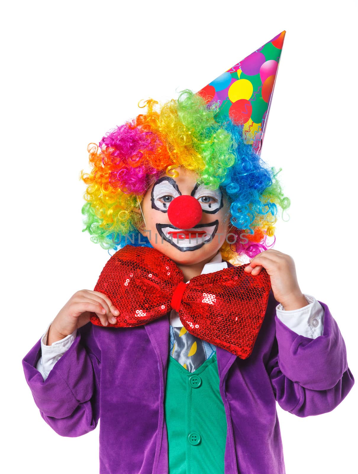 Portrait of a cute boy clown. Isolated on white background.