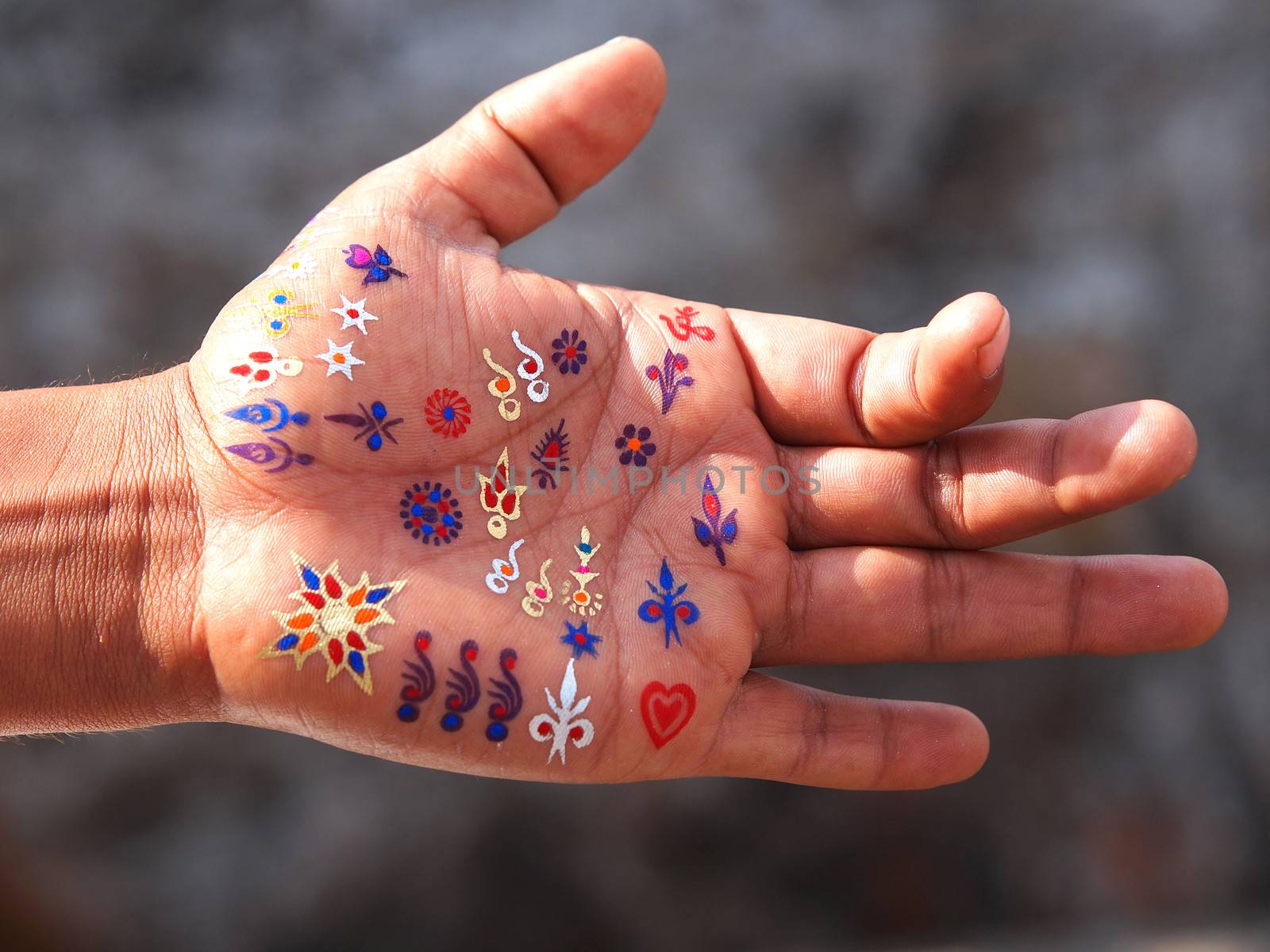 hand tattoo with symbols of india      