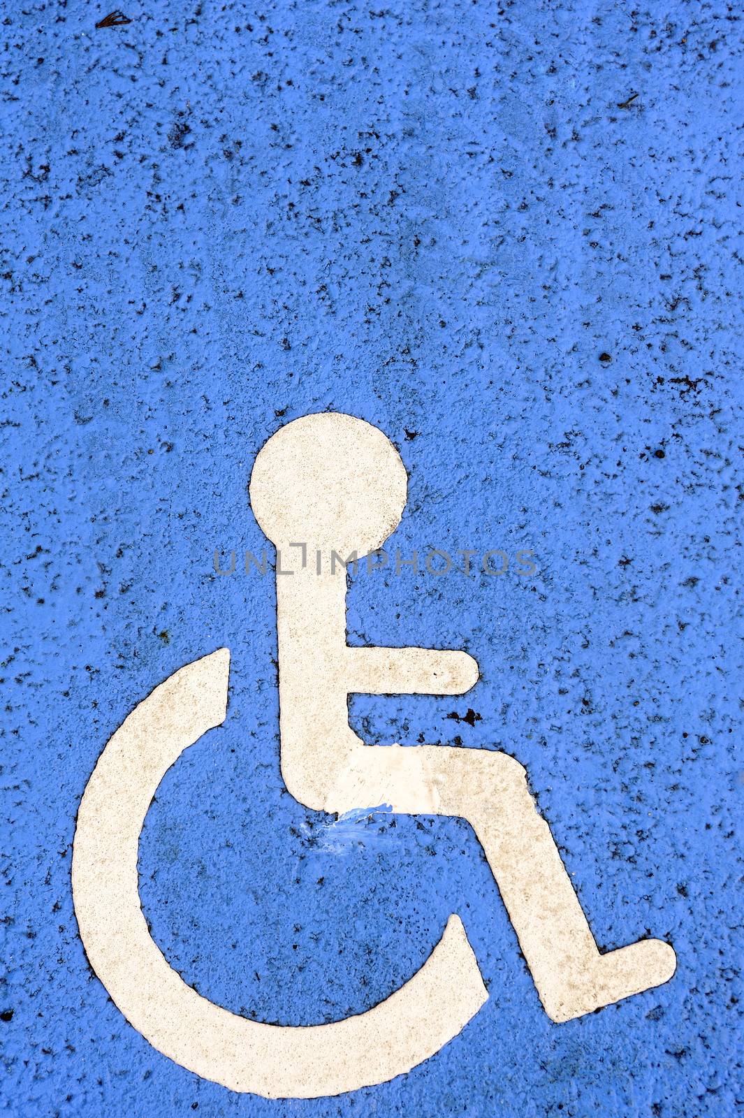 Parking space reserved for handicapped by gillespaire