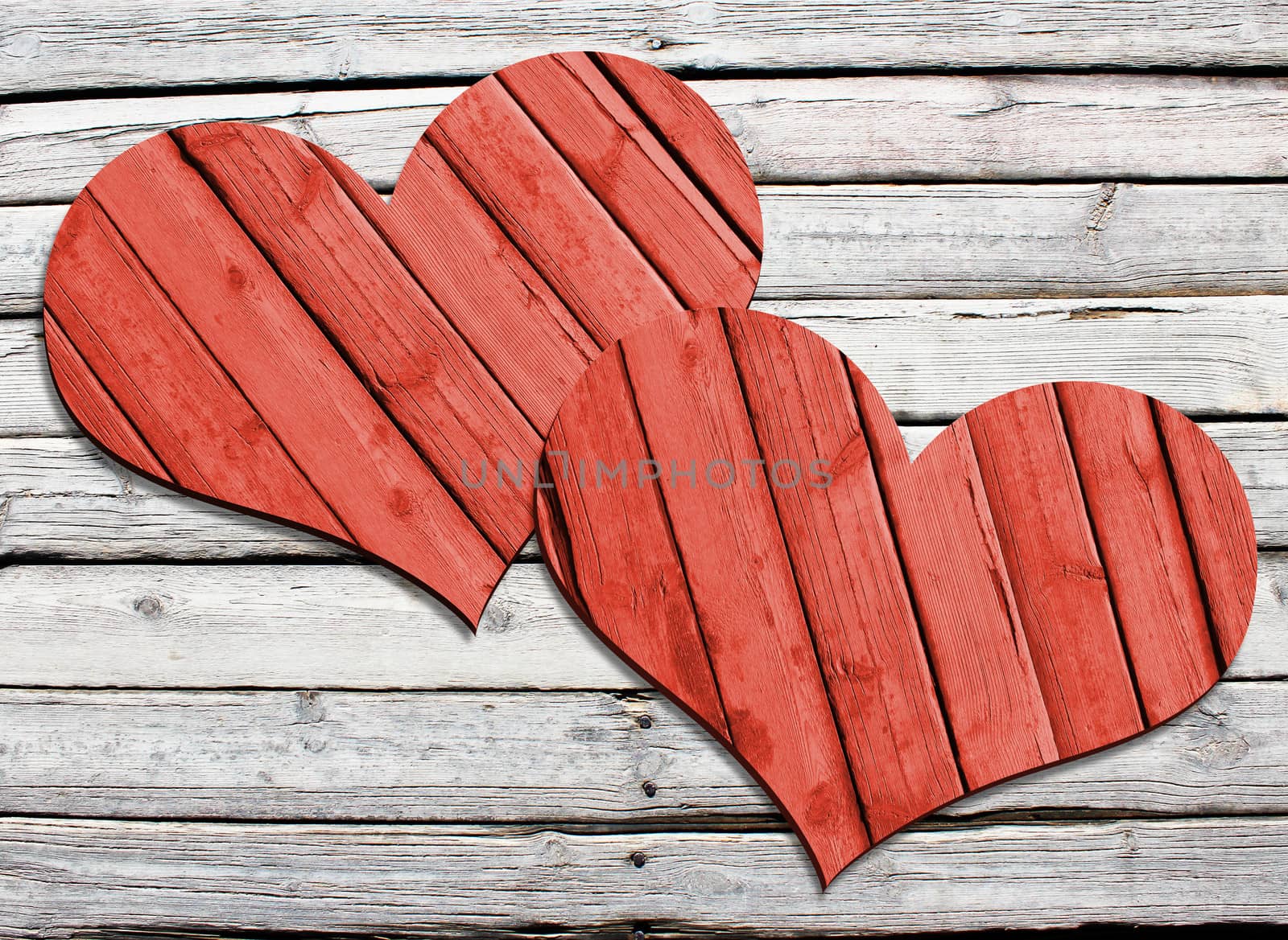 Two heart carved on a wooden surface. The concept of Valentine's Day