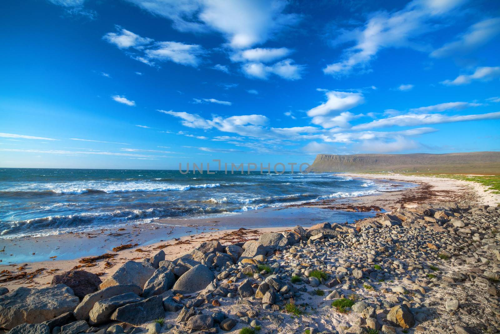 Landscape with white beach at Iceland ocean coast. Panorama.