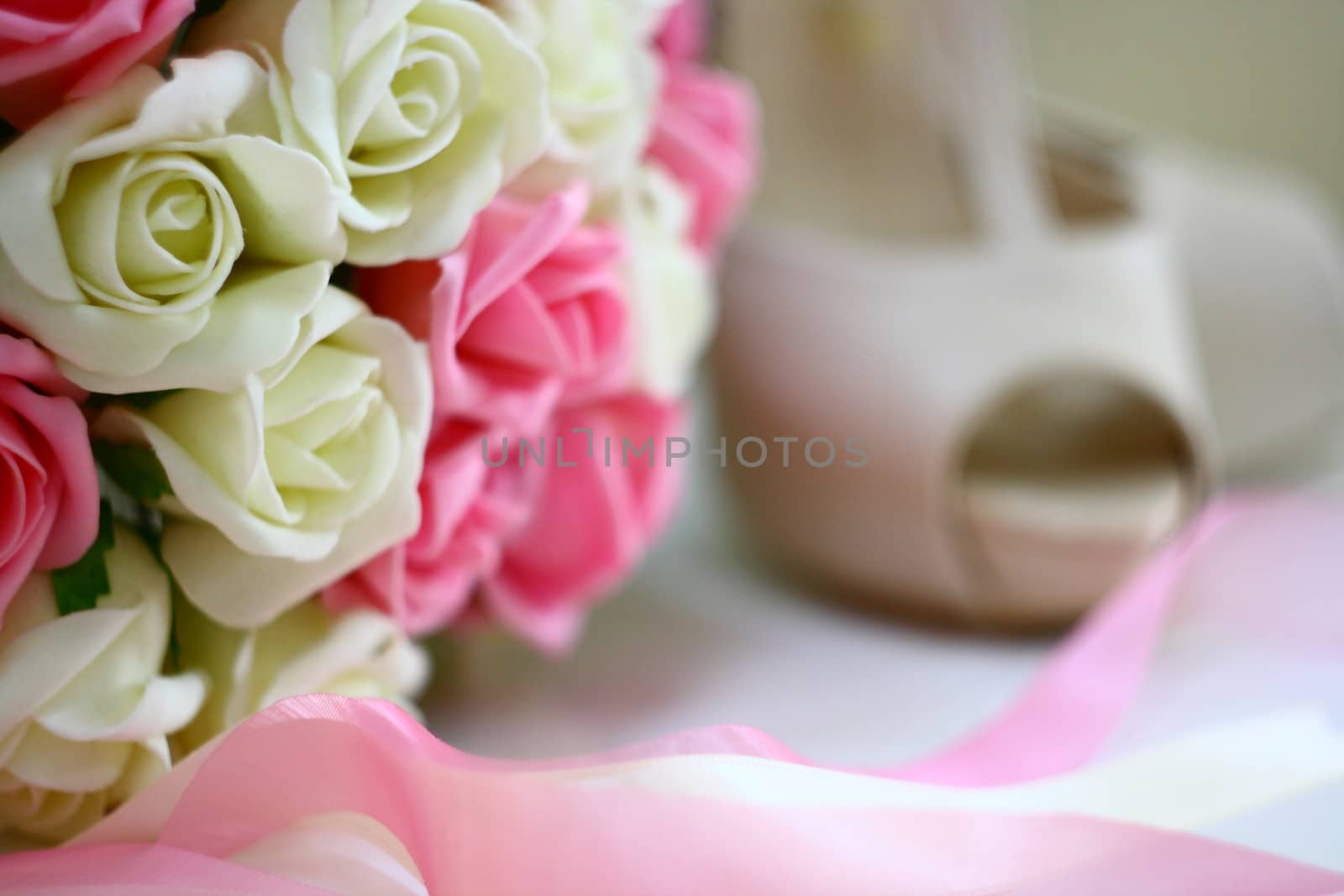 woman shoes and beautiful flower bouquet in marriage 