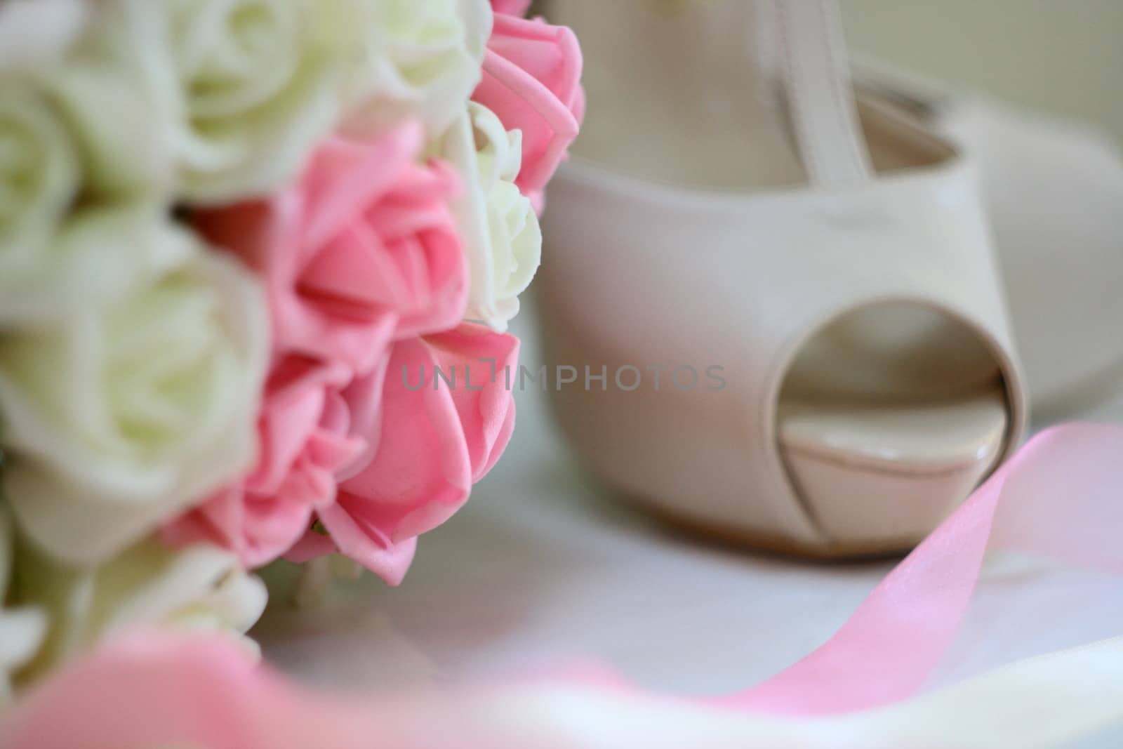 woman shoes and beautiful flower bouquet in marriage 