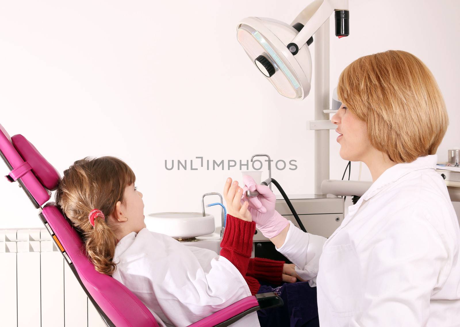 scared little girl and dentist by goce