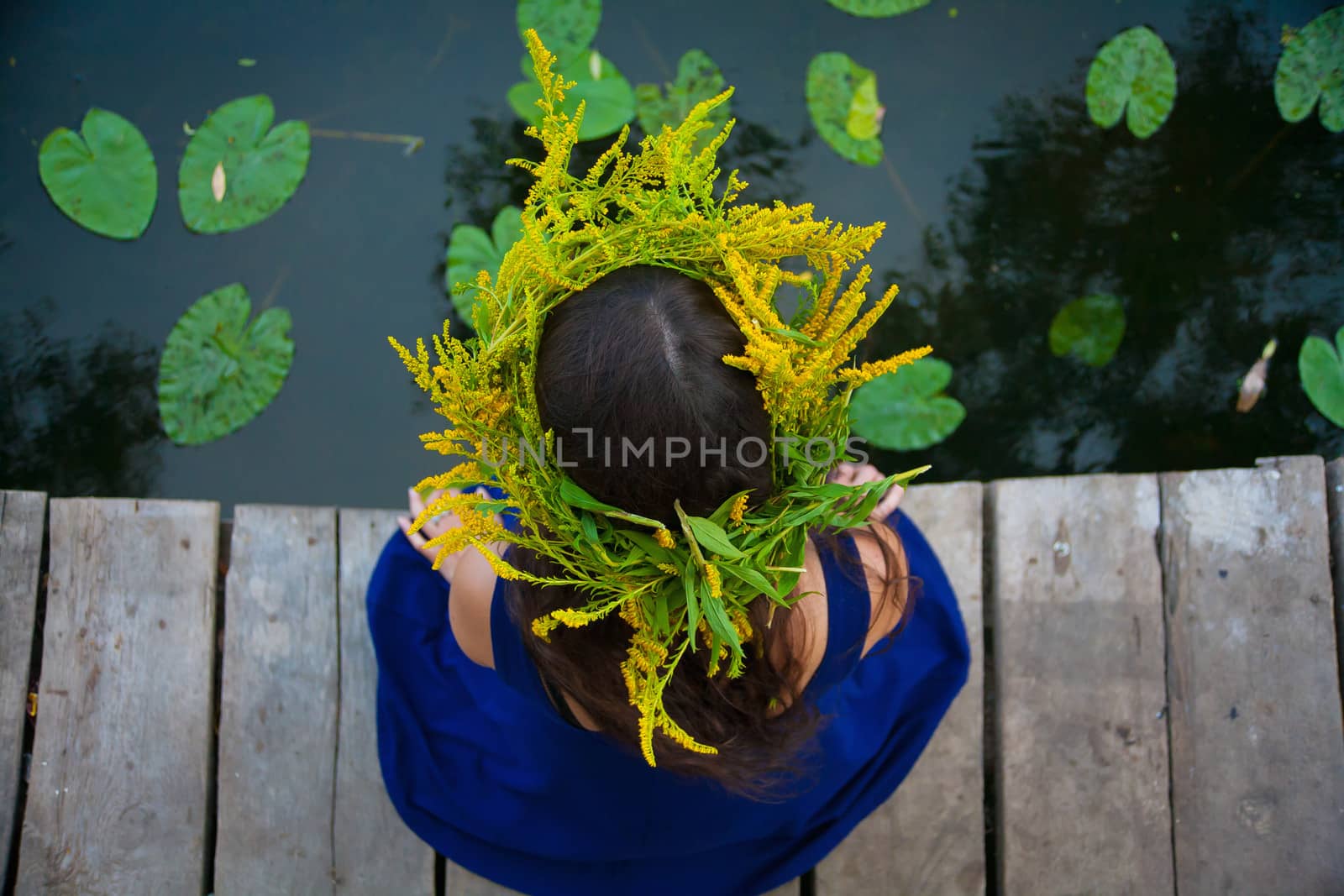 girl by the lake with a wreath on head by sfinks