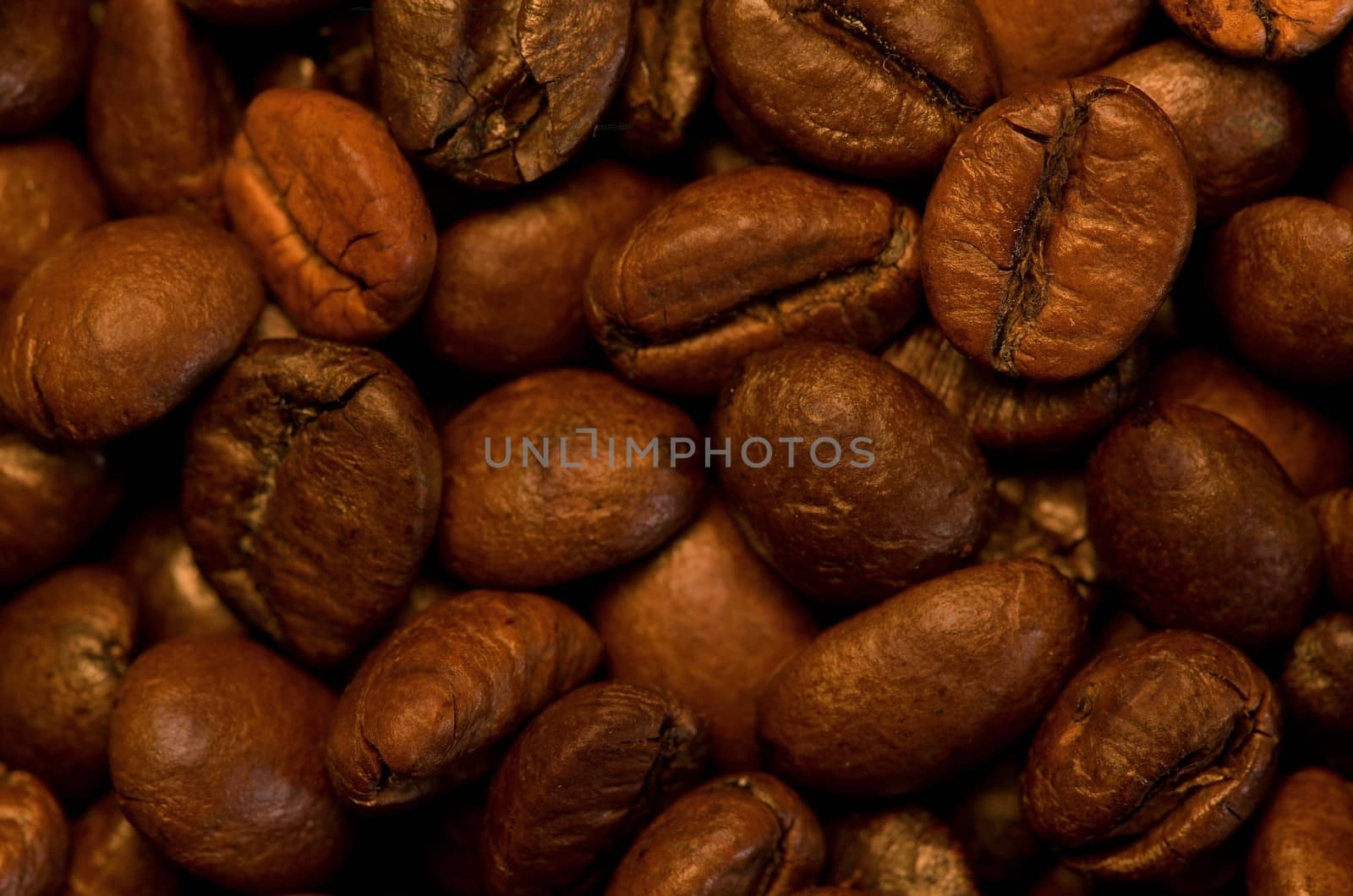 several roasted coffee seeds like texture and background